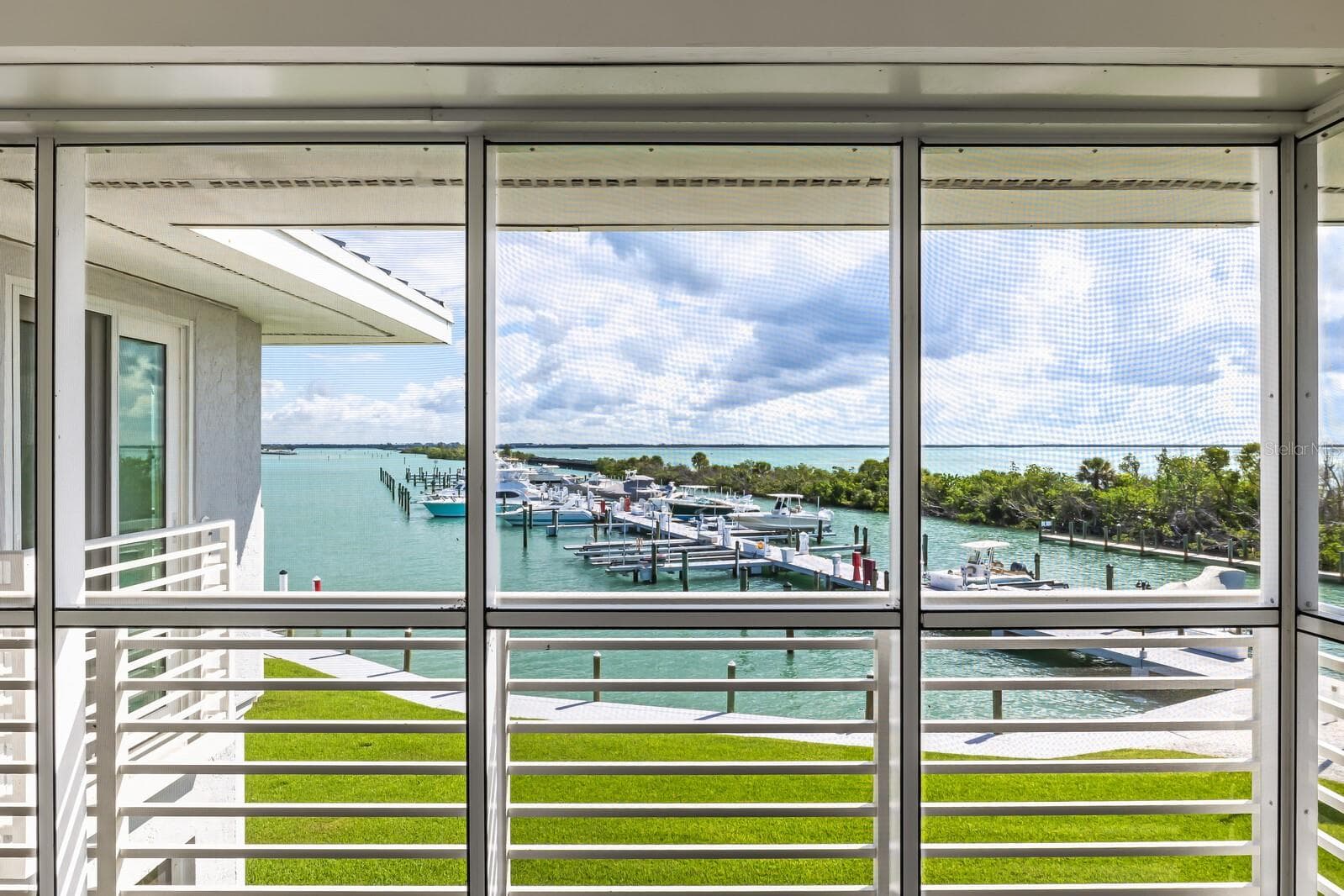 View to Gasparilla Sound & Uncle Henry's Marina - picture your boat in the back yard for under $500k at the Boca Grande Club! - 5850 GASPARILLA RD #M4, BOCA GRANDE