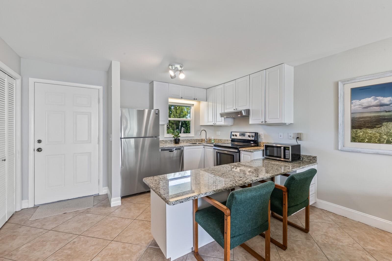 Kitchen (hot water heater and utility closet just inside the front door). - 5850 GASPARILLA RD #M4, BOCA GRANDE