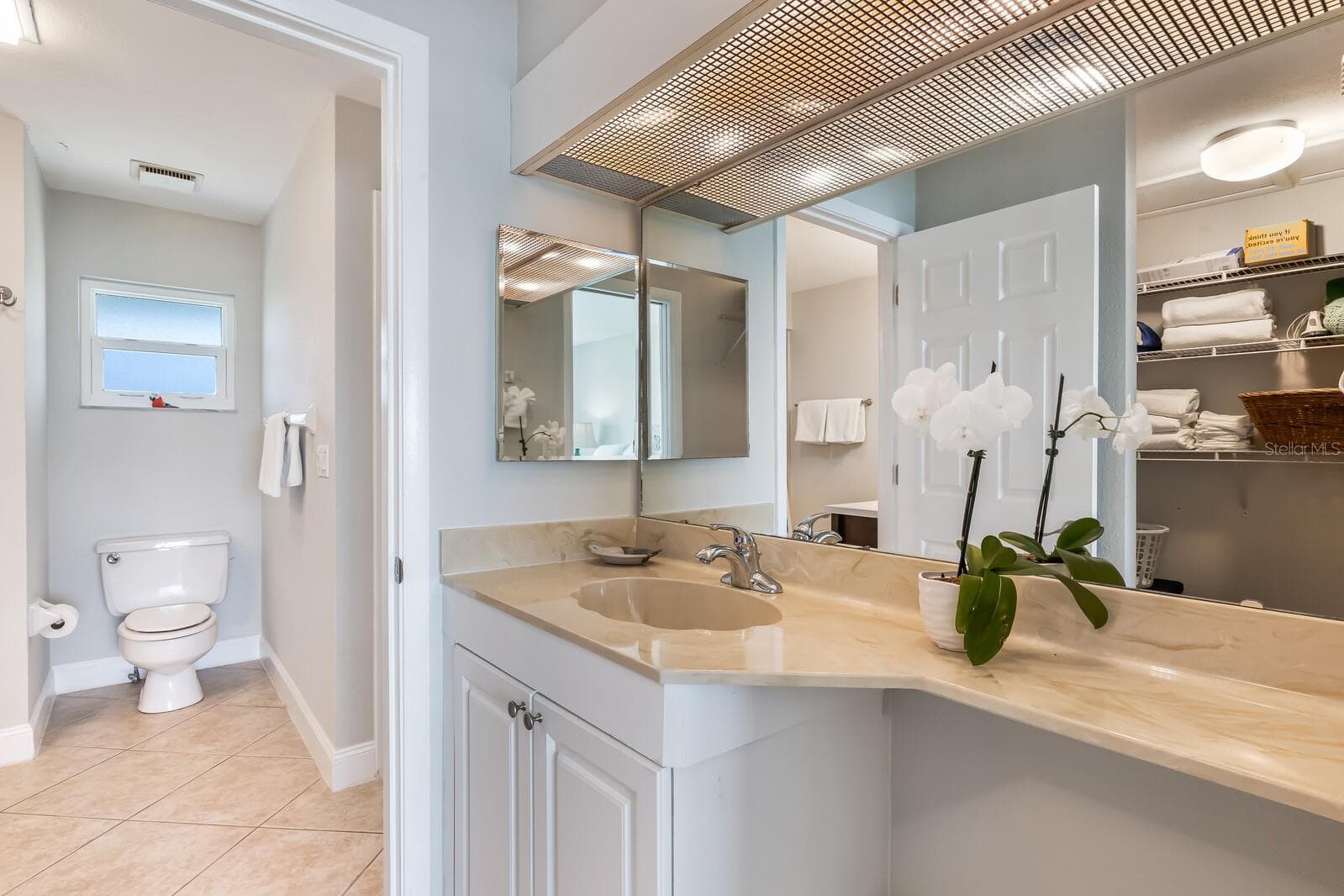 Make-up vanity in hallway that includes a generous walk-in closet (in hallway between primary bedroom/bathroom) - 5850 GASPARILLA RD #M4, BOCA GRANDE