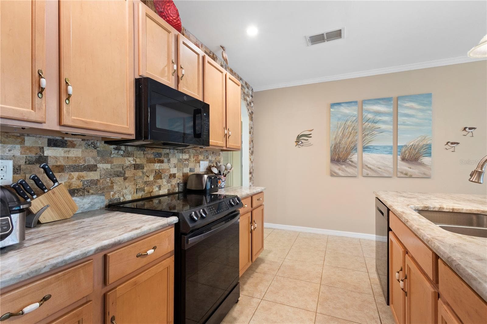 Granite countertops and ample counter and cabinet space. - 9259 CALUMET BLVD, PORT CHARLOTTE