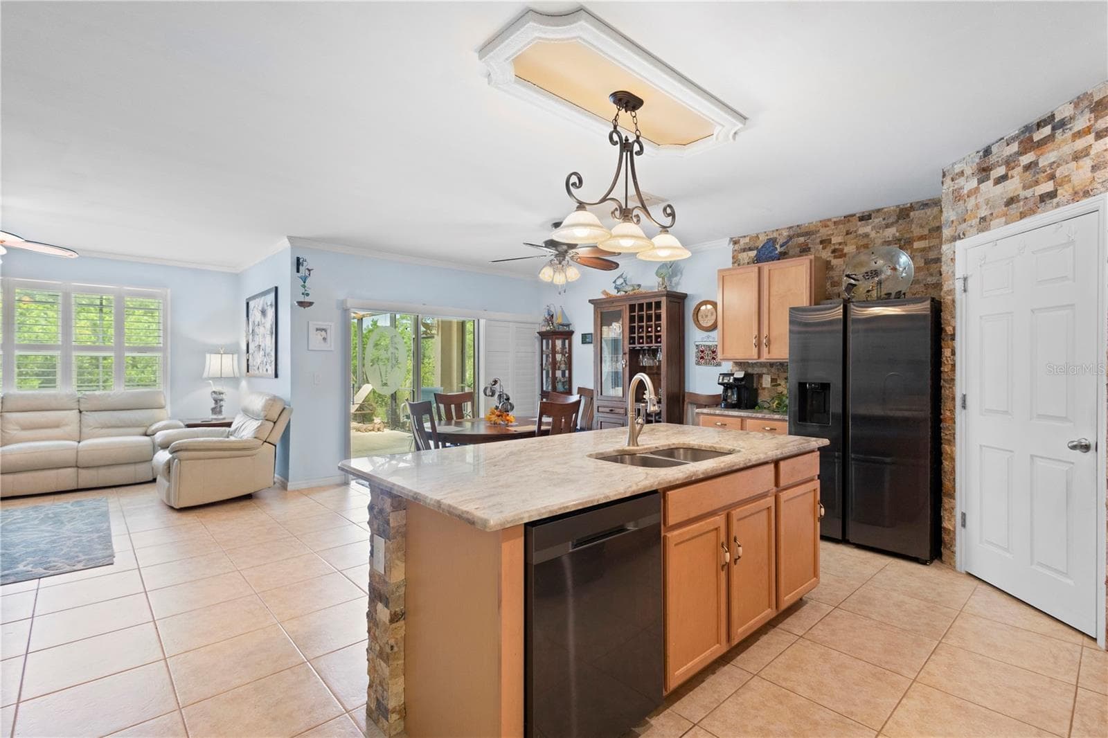 Kitchen opens to Living Room, perfect for relaxing and entertaining. - 9259 CALUMET BLVD, PORT CHARLOTTE
