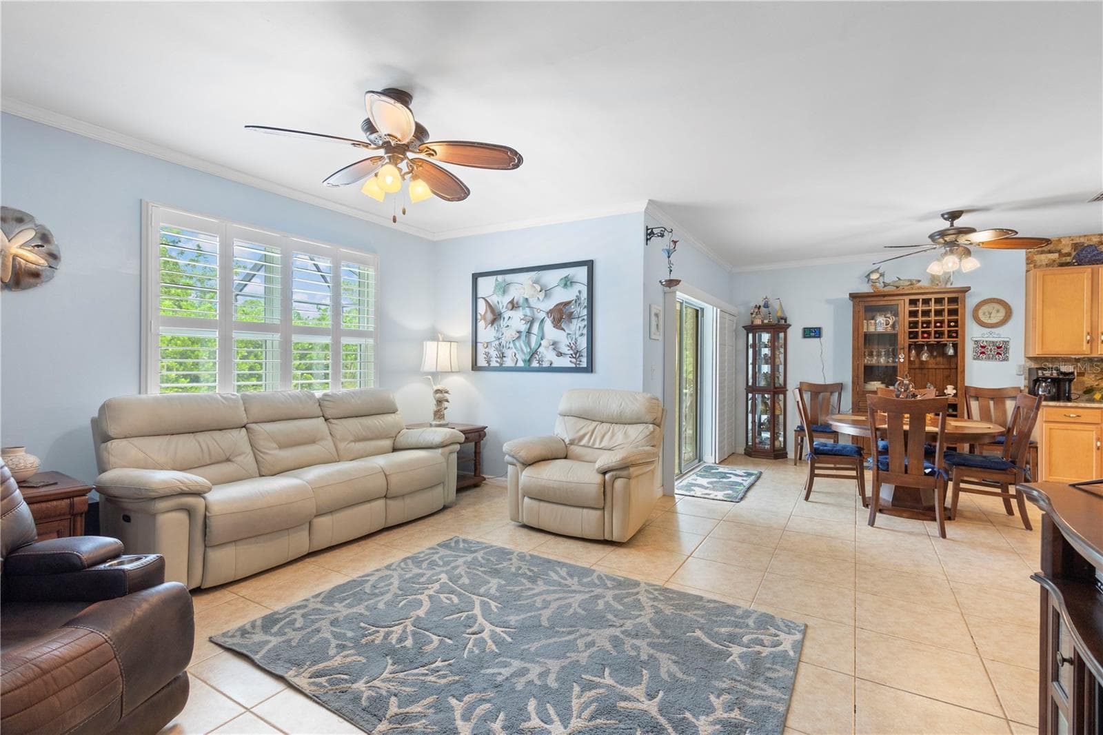 Living Room with large picture window with plantation shutters. - 9259 CALUMET BLVD, PORT CHARLOTTE