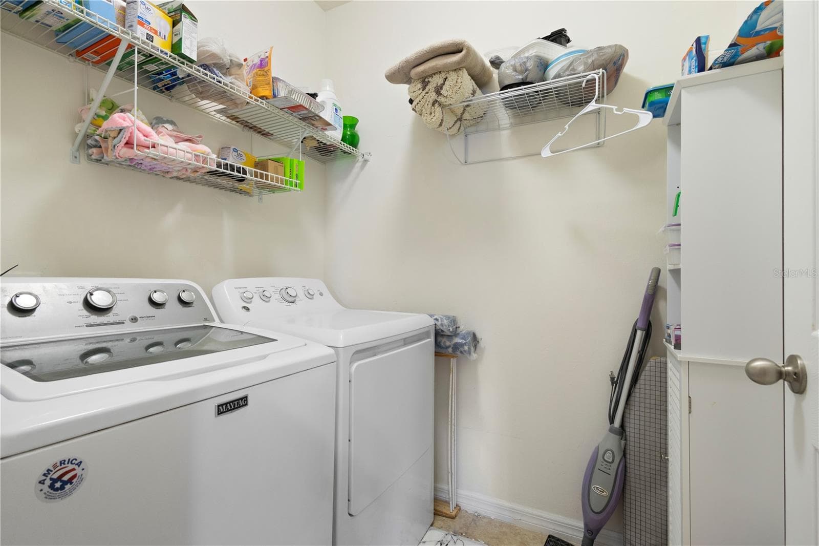 Laundry room with shelving. - 9259 CALUMET BLVD, PORT CHARLOTTE