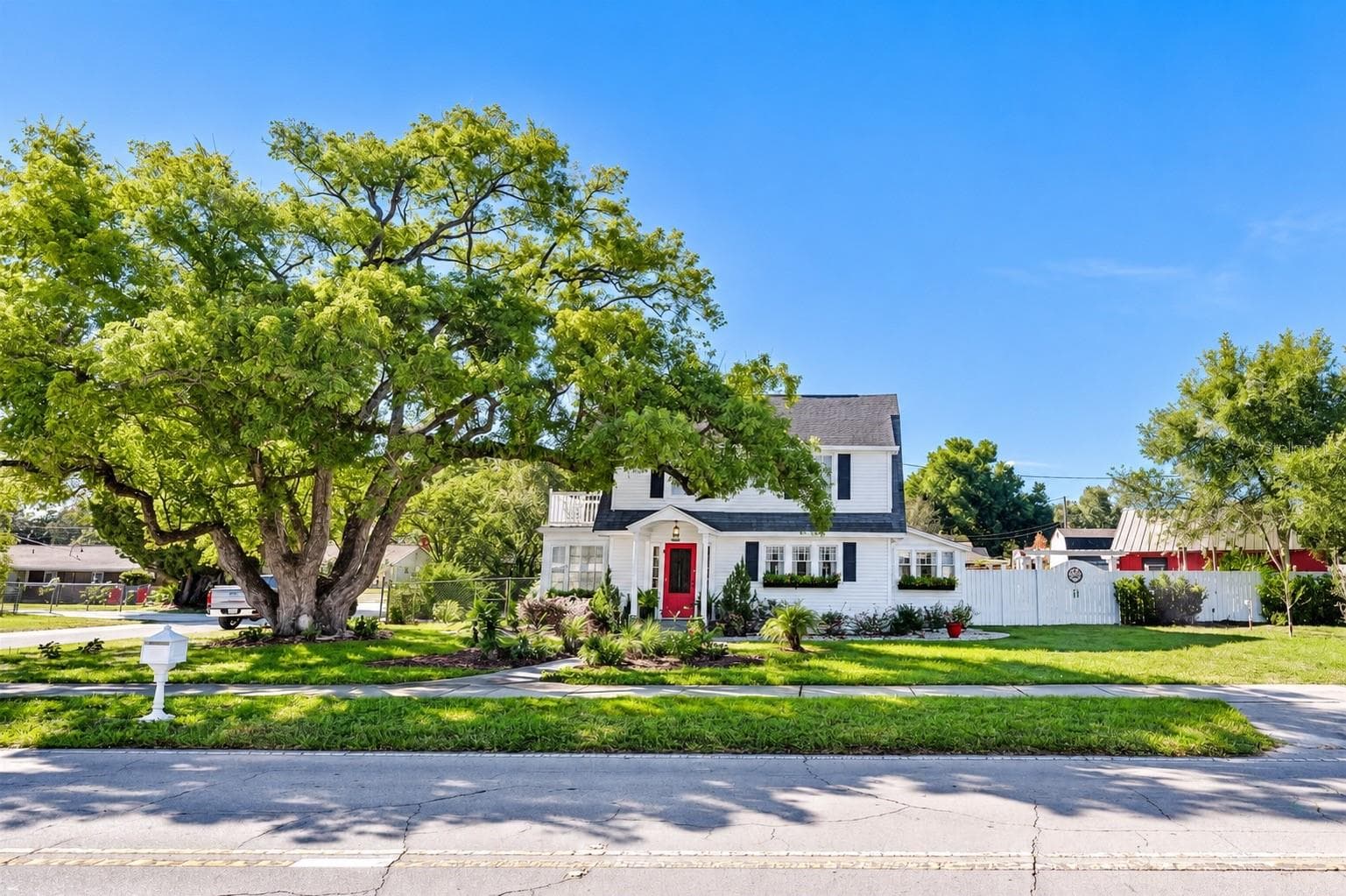 Charming farmhouse situated on an expansive .34-ACRE CORNER LOT, featuring a spacious FENCED BACKYARD, a BARN WITH ELECTRICITY, and an incredible variety of EDIBLE FRUIT TREES, PLANTS, AND HERBS! Enjoy the beauty of mature trees, lush landscaping, and your very own backyard oasis, perfect for gardening, homesteading, and embracing a FARM-TO-TABLE LIFESTYLE right at home! - 1901 10TH ST, ST CLOUD