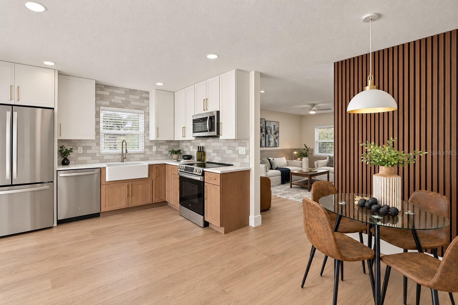 Dinette space with acoustic paneling and modern pendant light - 1613 GREENWOOD DR, DUNEDIN