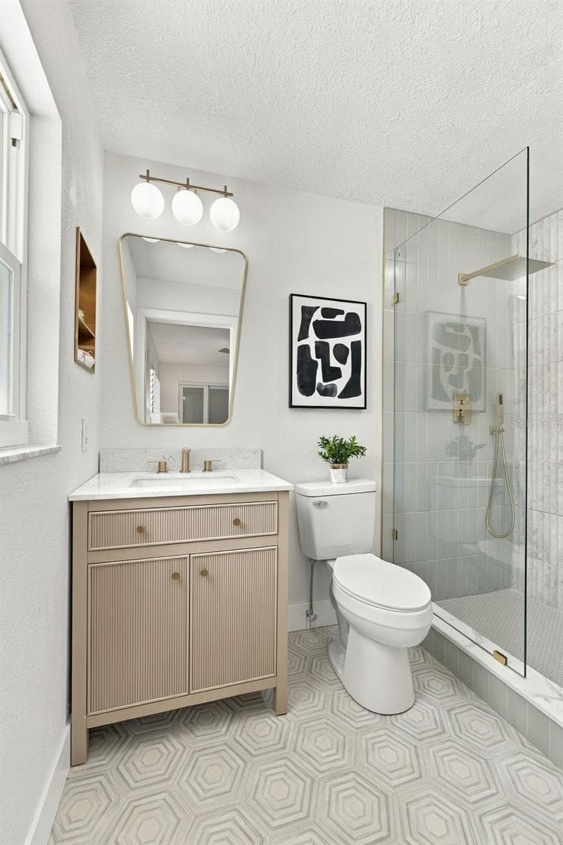 Spa like Primary en suite bathroom with designer finishes - 1613 GREENWOOD DR, DUNEDIN