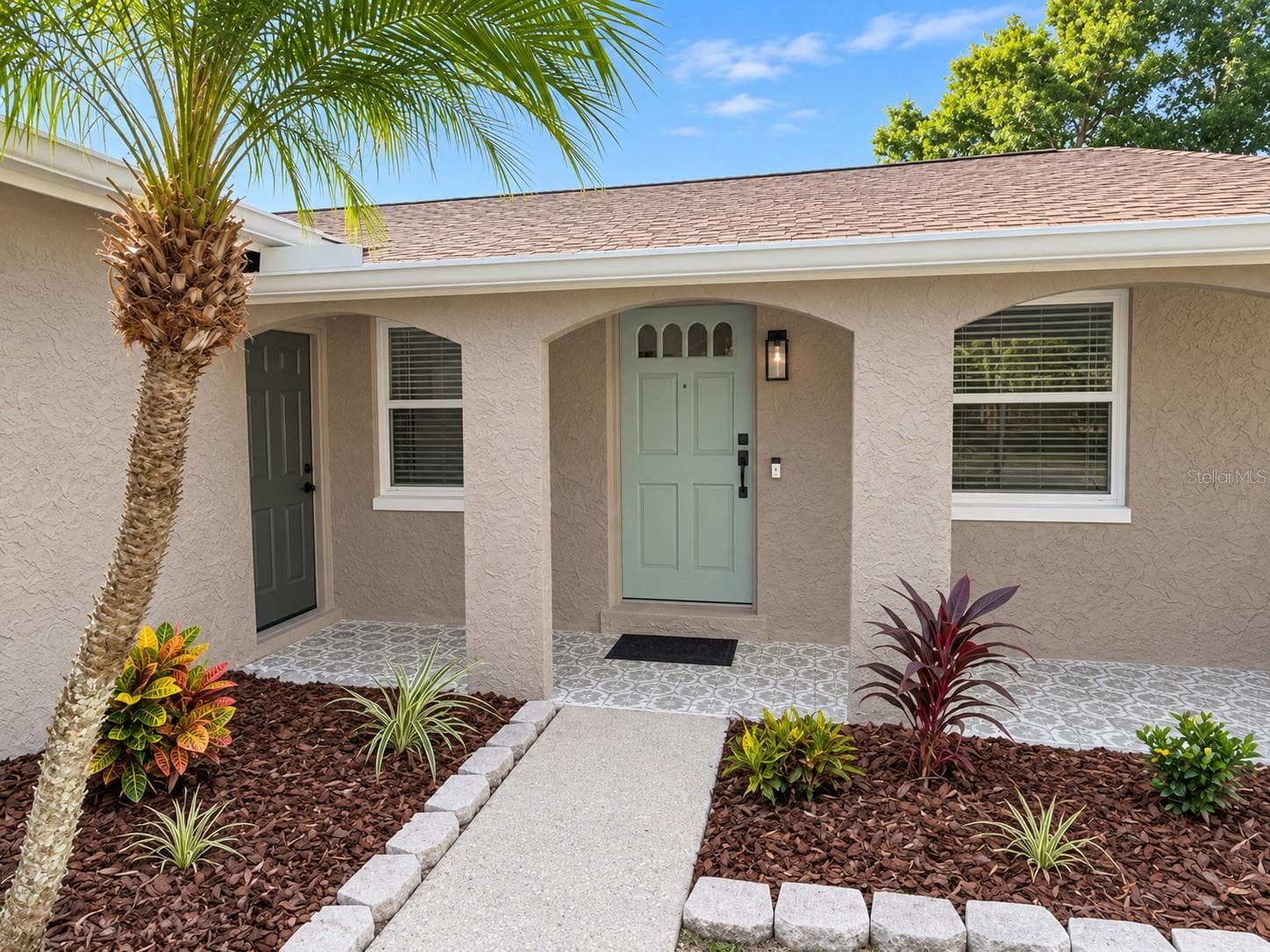 Front porch with mosaic tile flooring - 1613 GREENWOOD DR, DUNEDIN