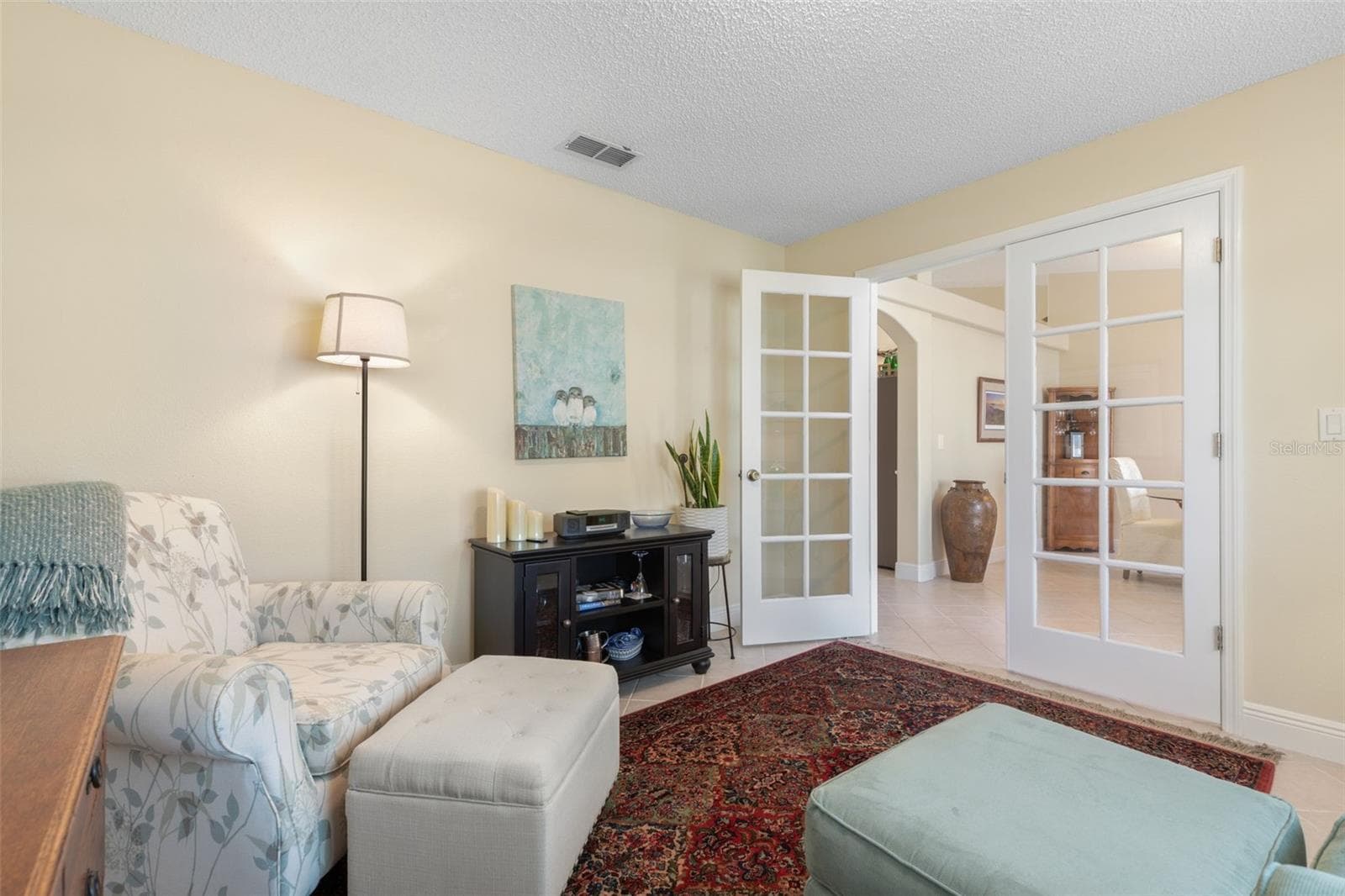 Beautiful French doors provide the option for privacy or an open connection to the rest of the home, making this delightful room equally suited for a productive workday or a little well-deserved downtime. - 19 EDGELY LN, PALM COAST