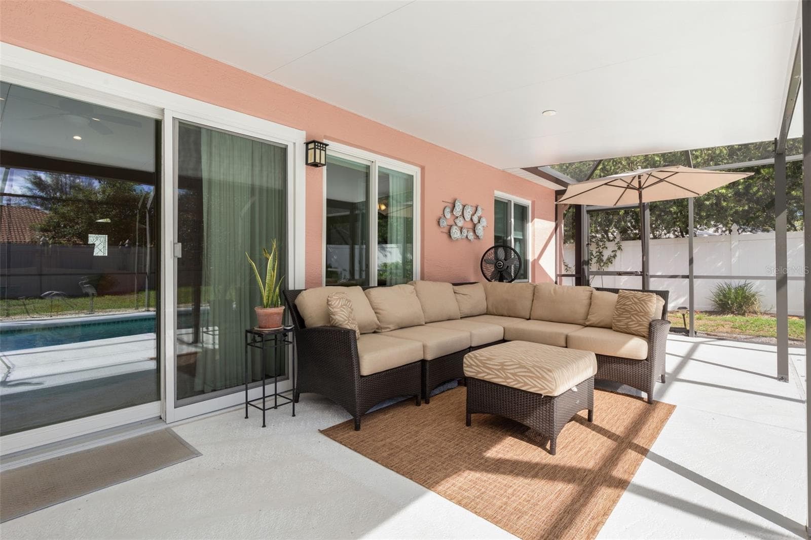 Stretching along the rear of the home, the expansive covered patio provides an exceptional extension of your living space, with ample room to create your own outdoor oasis while enjoying the beauty of Florida's year-round climate. - 19 EDGELY LN, PALM COAST