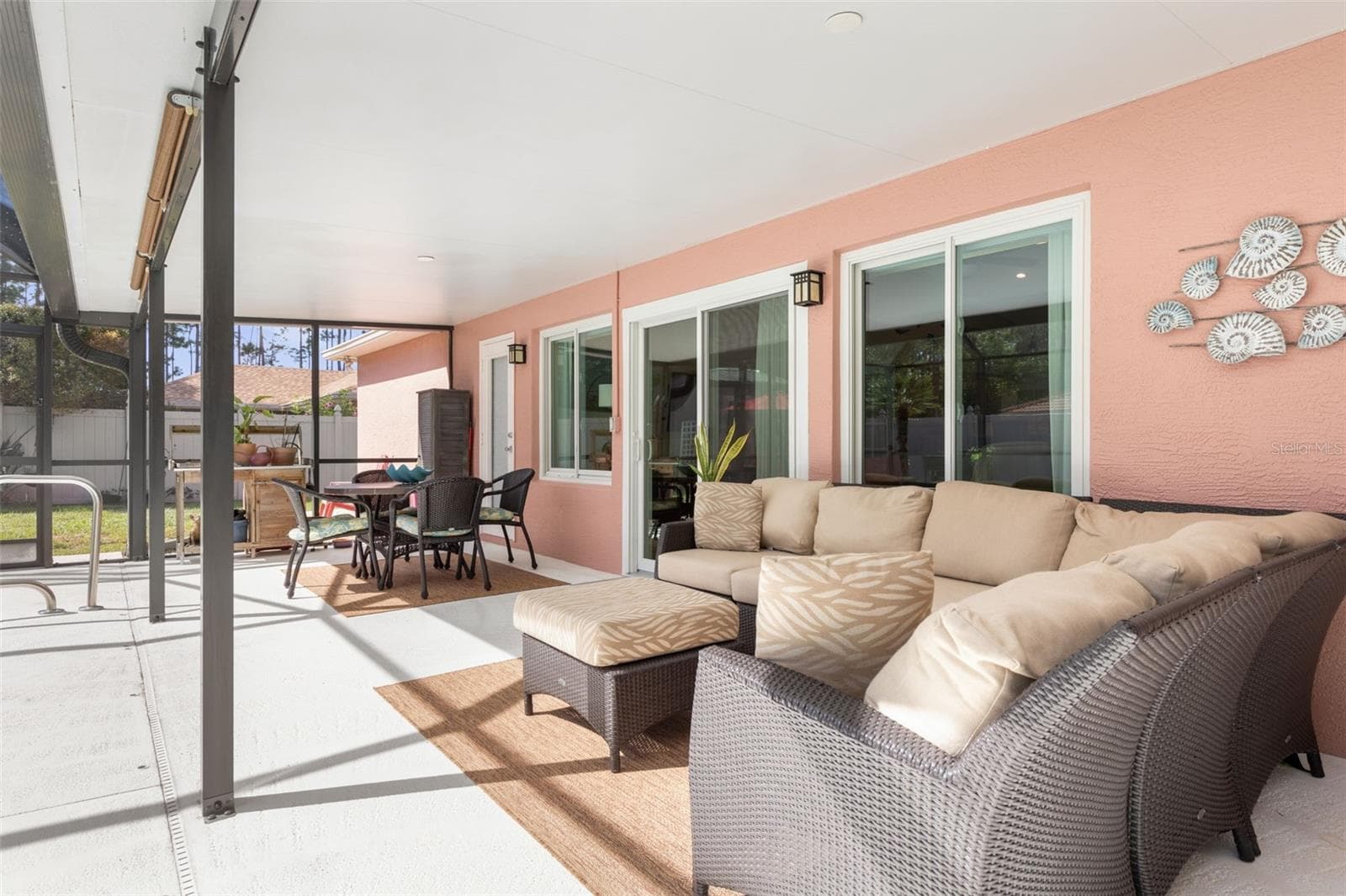 Rain or shine, the fun doesn't have to stop! This generously sized covered lanai offers a sheltered place to enjoy the outdoors, with plenty of possibilities for creating your own favorite poolside hangout. - 19 EDGELY LN, PALM COAST