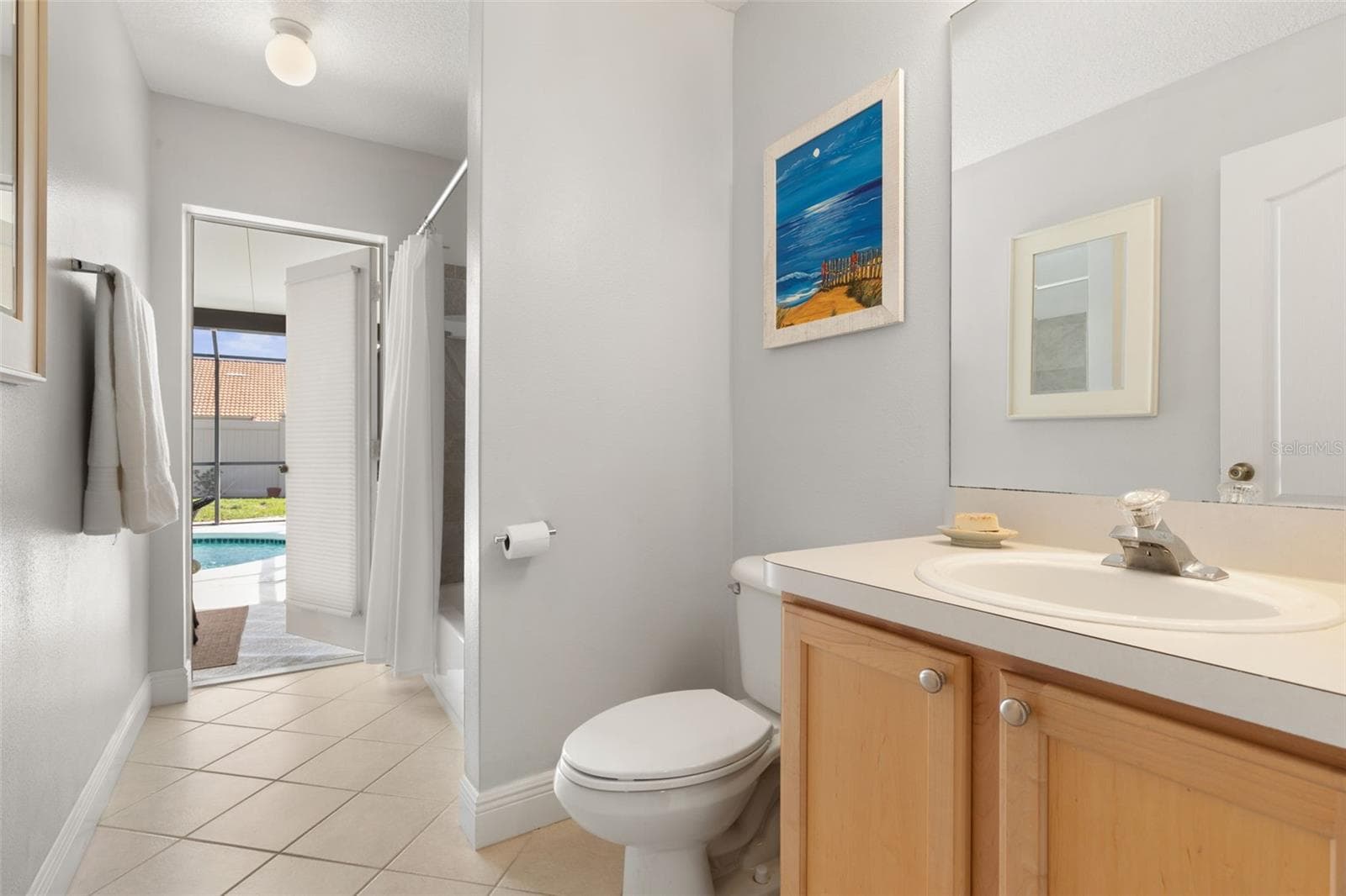 The guest bath offers convenient access to the pool area, making it easy to rinse off and return to the sunshine without tracking through the house. - 19 EDGELY LN, PALM COAST