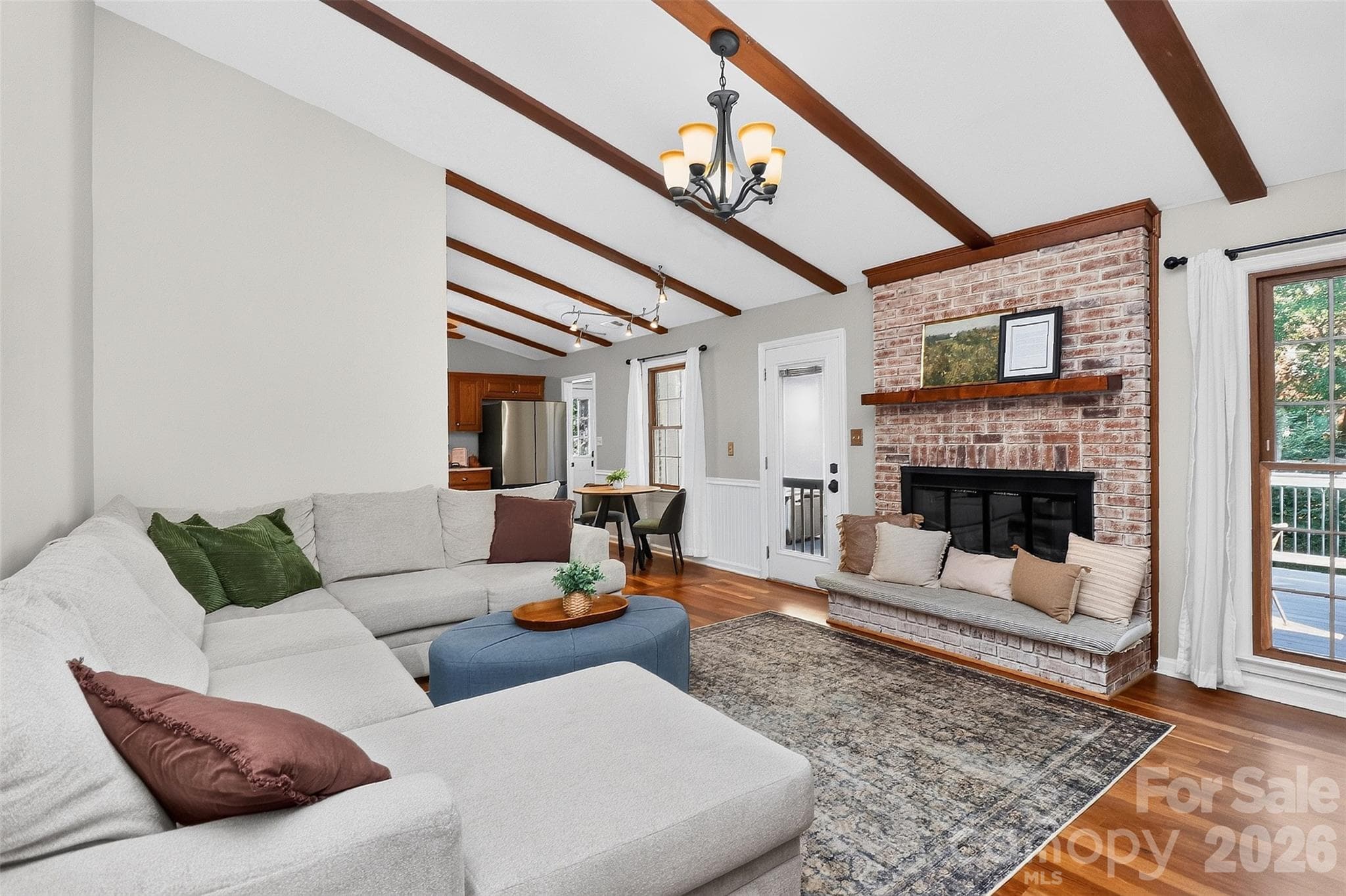 HUGE Great room for luxurious everyday living with access to the back deck. Gorgeous wood burning fireplace. - 9915 Ridgemore Drive, Charlotte