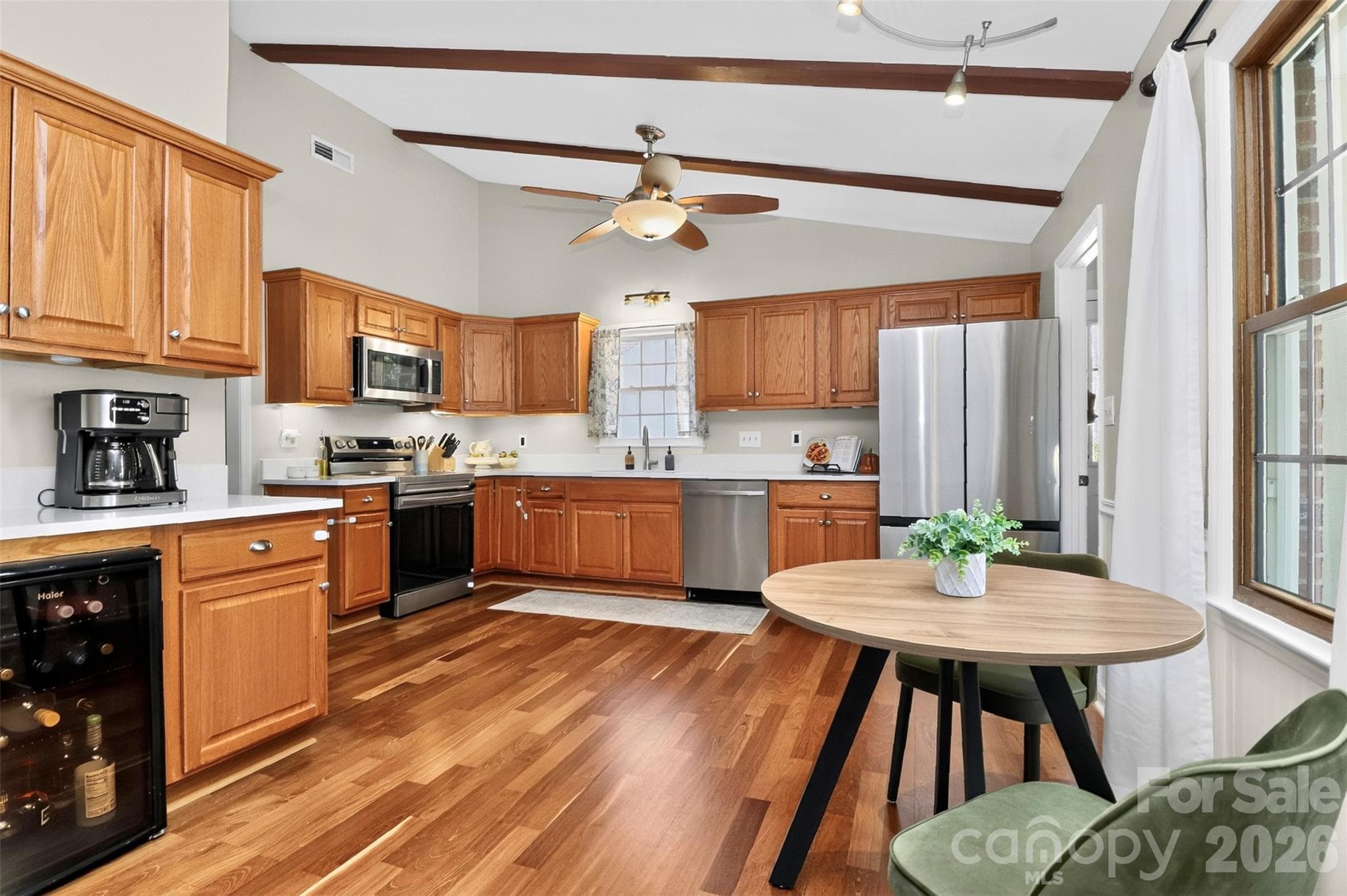 Expansive kitchen with custom quartz countertops. - 9915 Ridgemore Drive, Charlotte