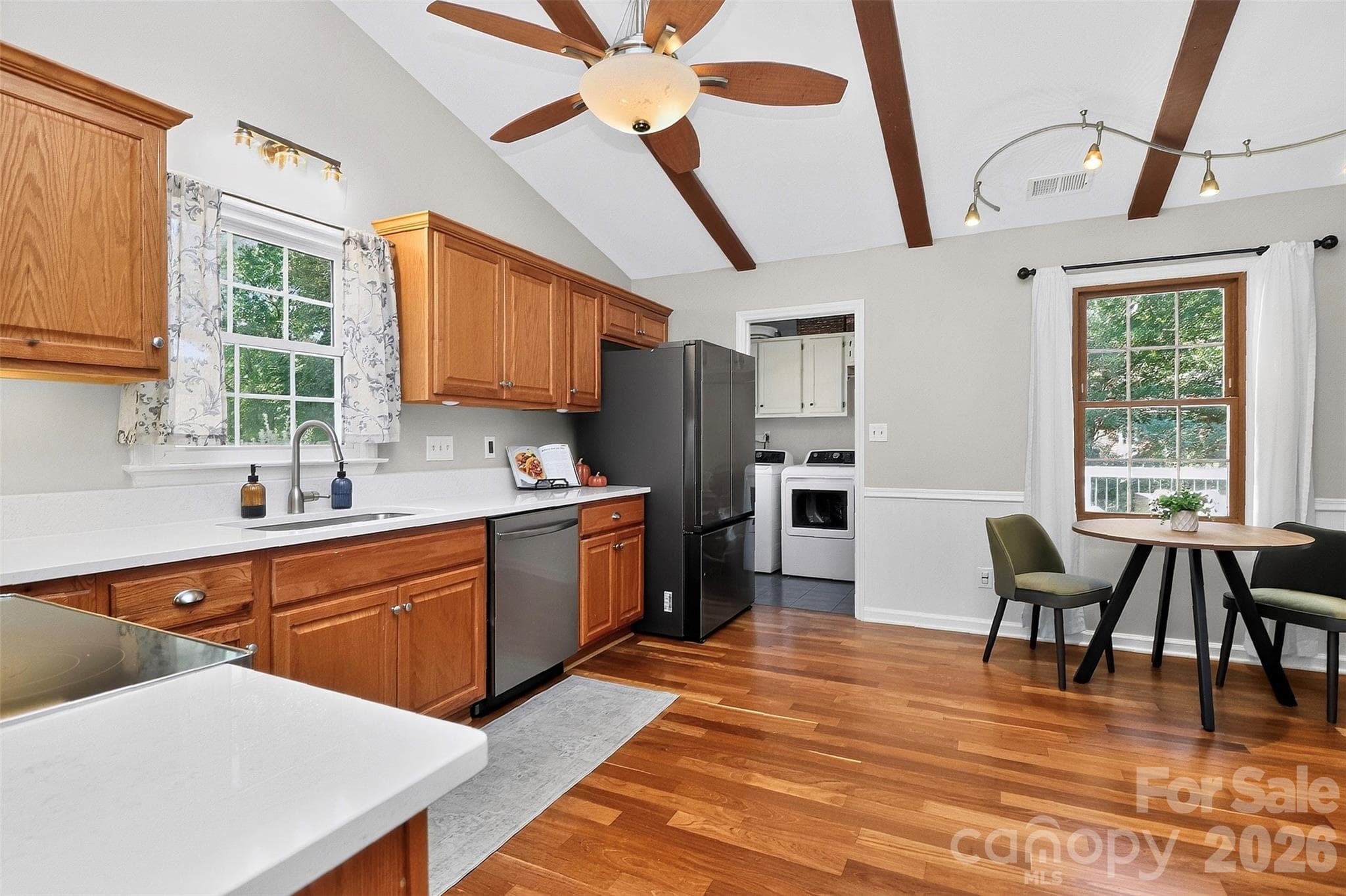 Spacious laundry room conveniently off the kitchen with side entry to the home. - 9915 Ridgemore Drive, Charlotte