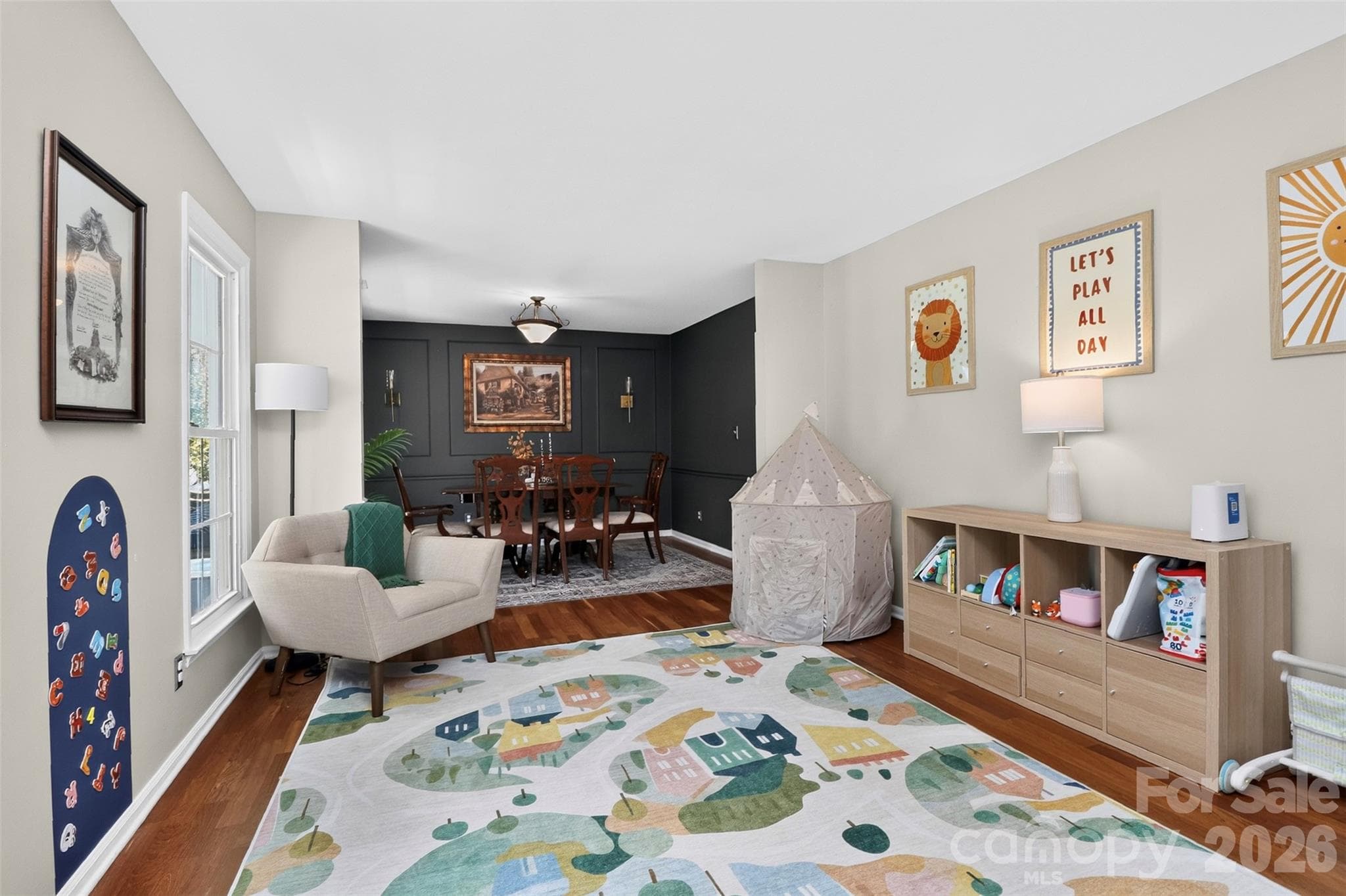 This space is open and bright, currently used as a play area, it is formally and traditionally "The Living Room" - 9915 Ridgemore Drive, Charlotte