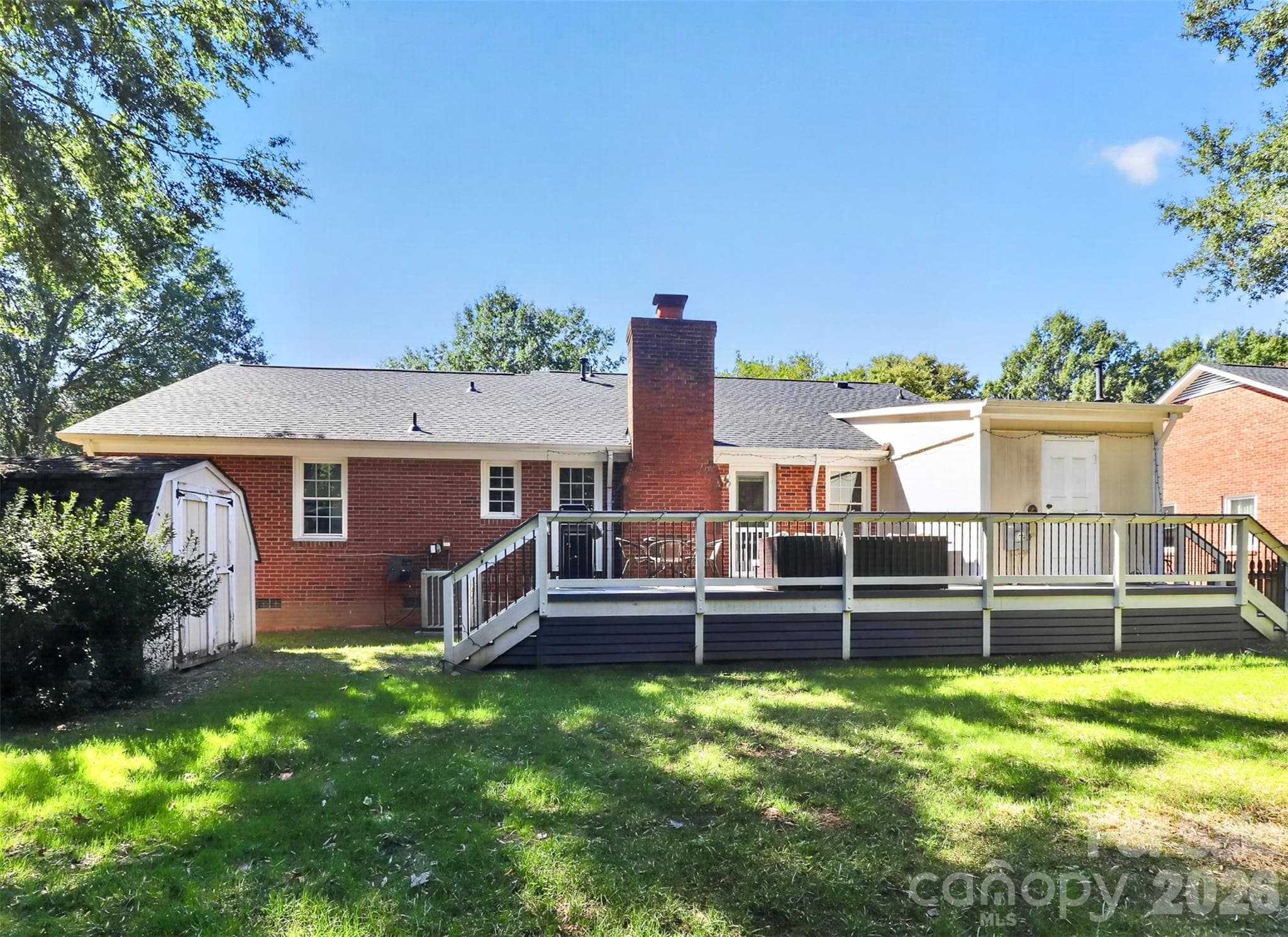 There is also an outdoor entry utility room for additional storage - 9915 Ridgemore Drive, Charlotte