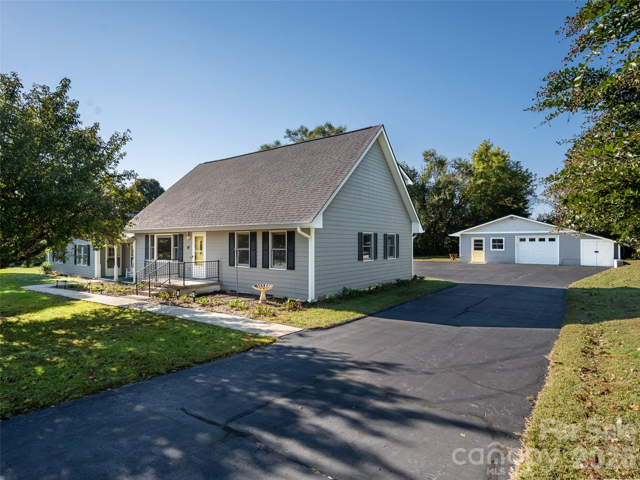 Wide driveway allows plenty of parking and playing spacee - 47 Cane Creek Circle, Fairview