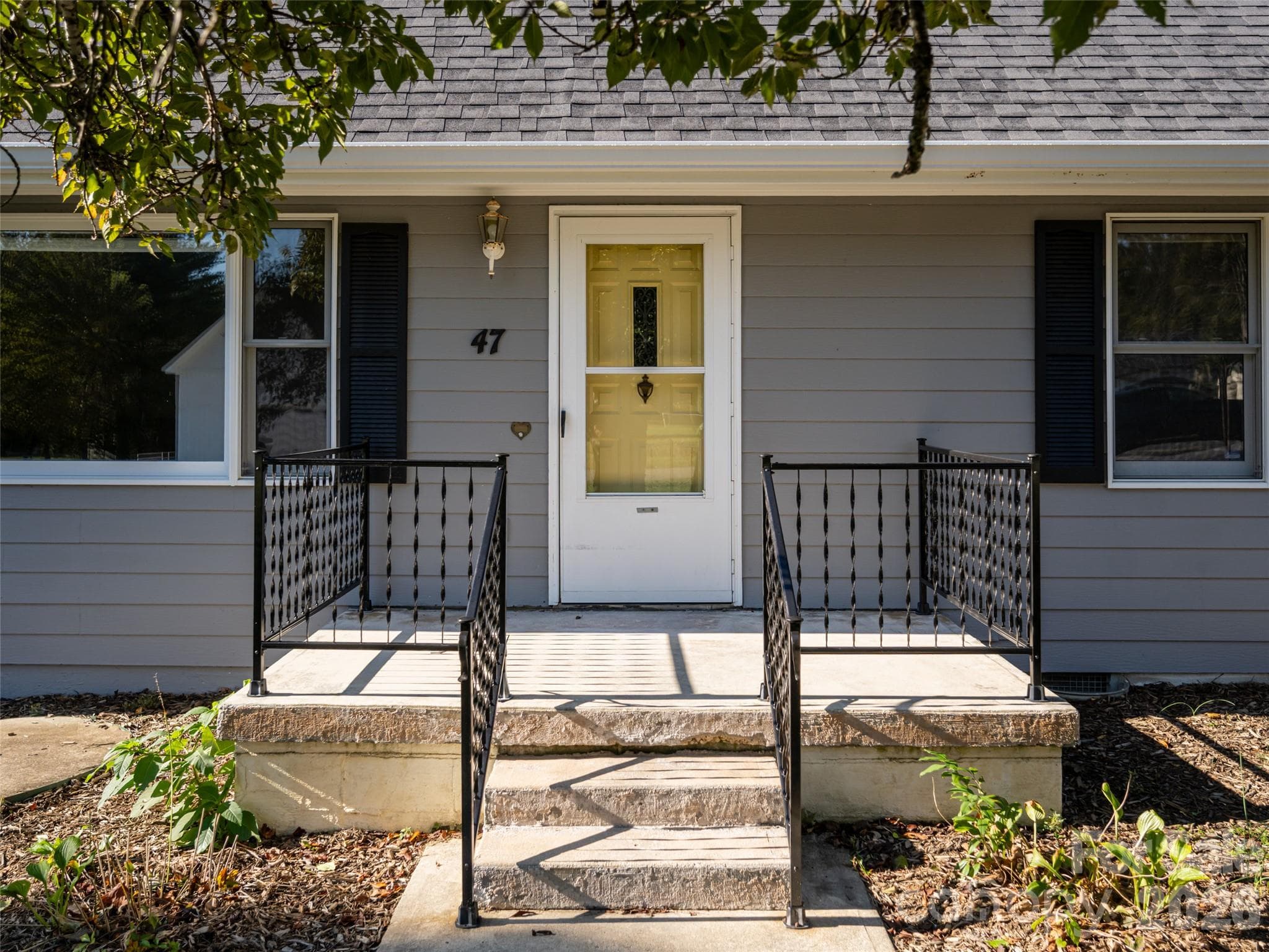 Welcoming front porch - 47 Cane Creek Circle, Fairview