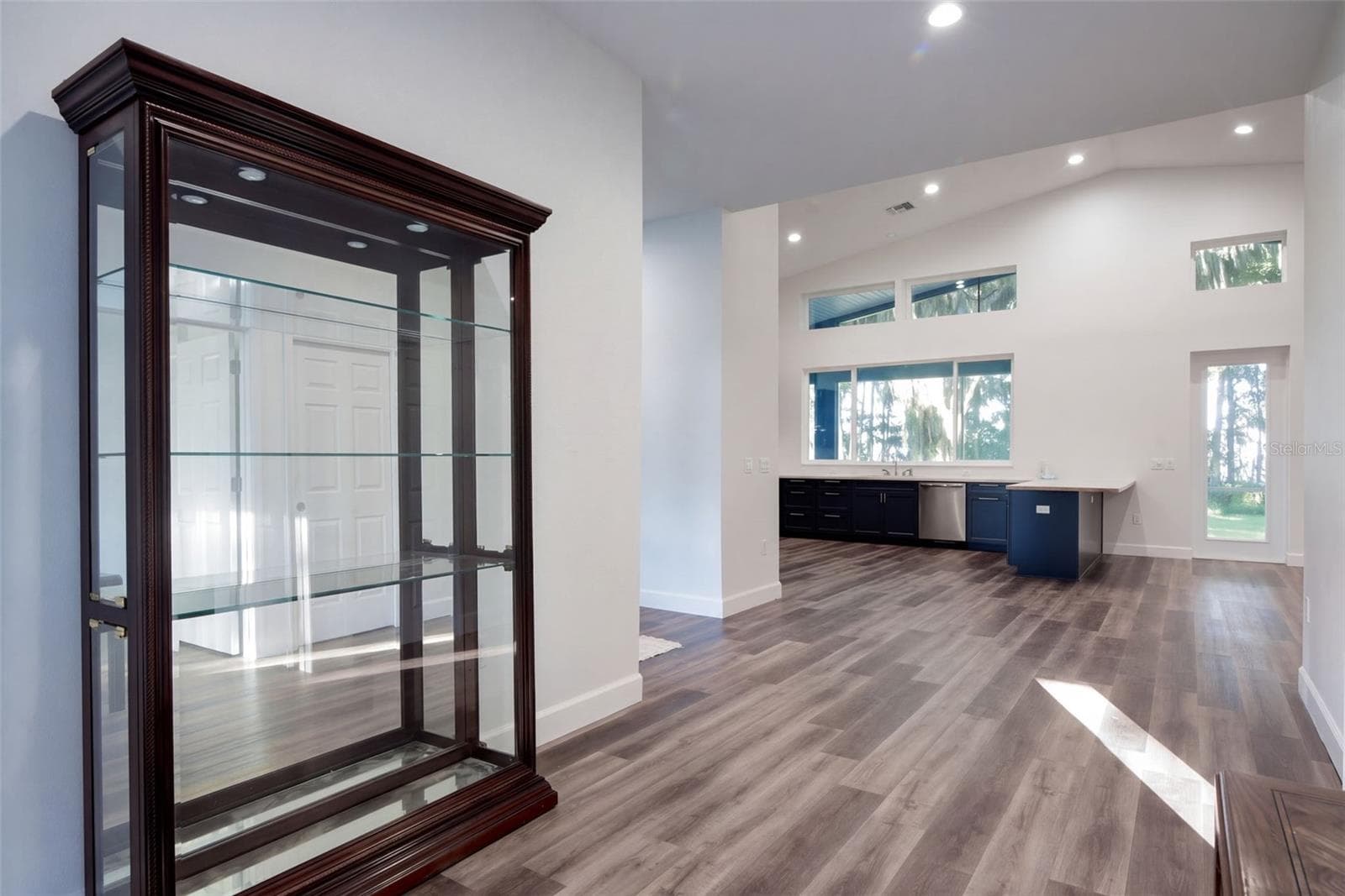 Foyer flows into the open kitchen and great room, with luxury vinyl plank throughout - 4410 CORLEY ISLAND RD, LEESBURG