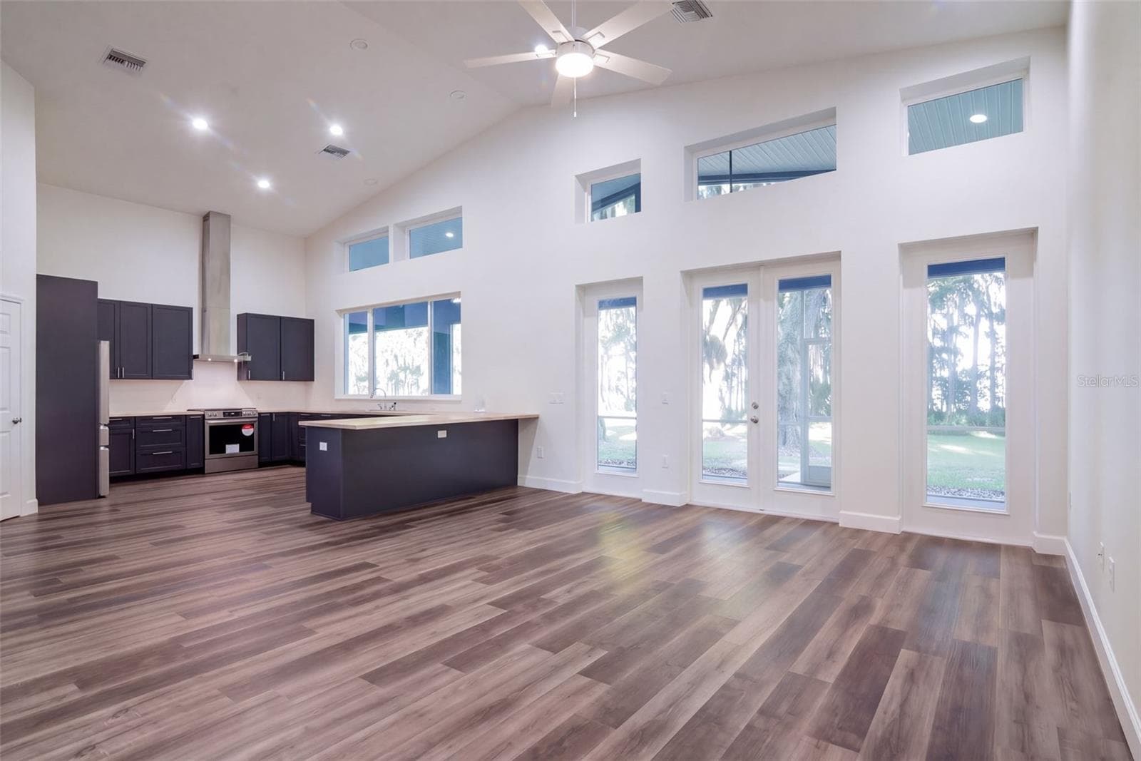 Open-concept living: soaring ceilings and natural light from every angle - 4410 CORLEY ISLAND RD, LEESBURG