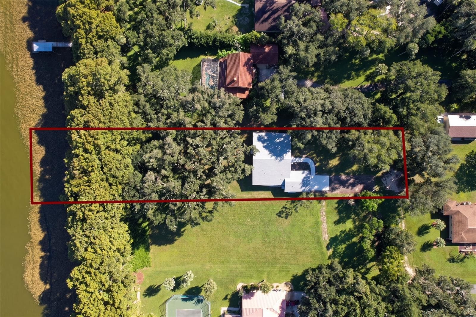 Aerial with estimated lot lines: 1.22 acres running to the water (lines approximate) - 4410 CORLEY ISLAND RD, LEESBURG