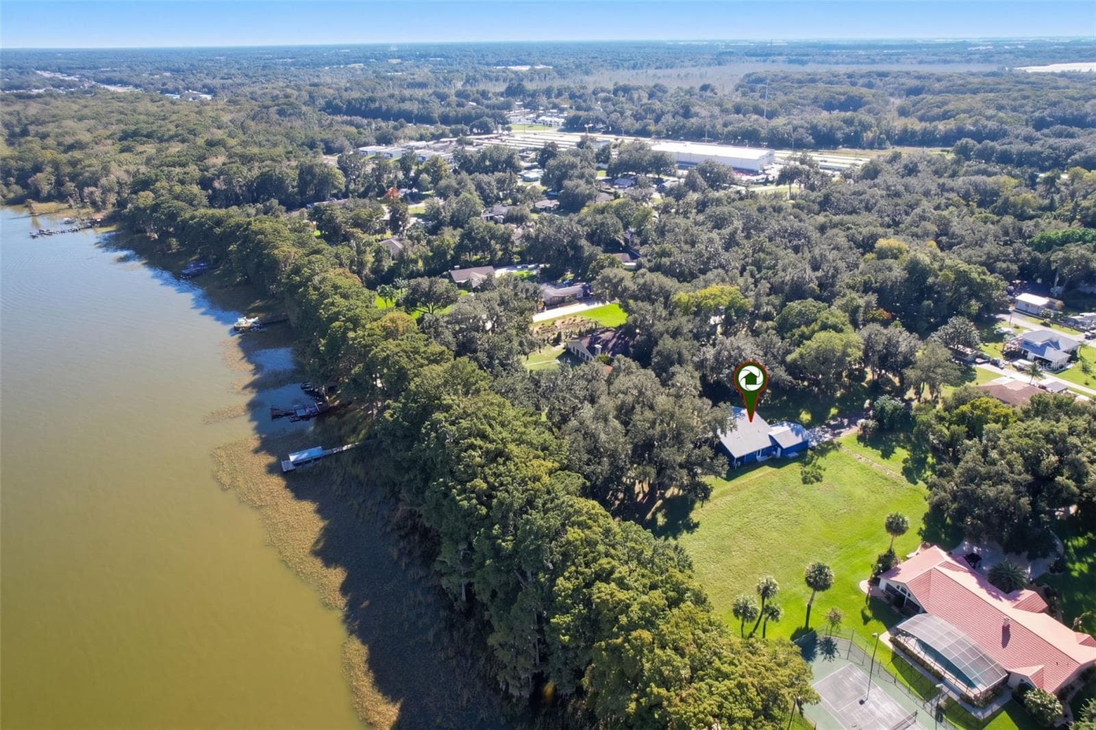 Aerial of the Lake Harris shoreline with the home marked - 4410 CORLEY ISLAND RD, LEESBURG