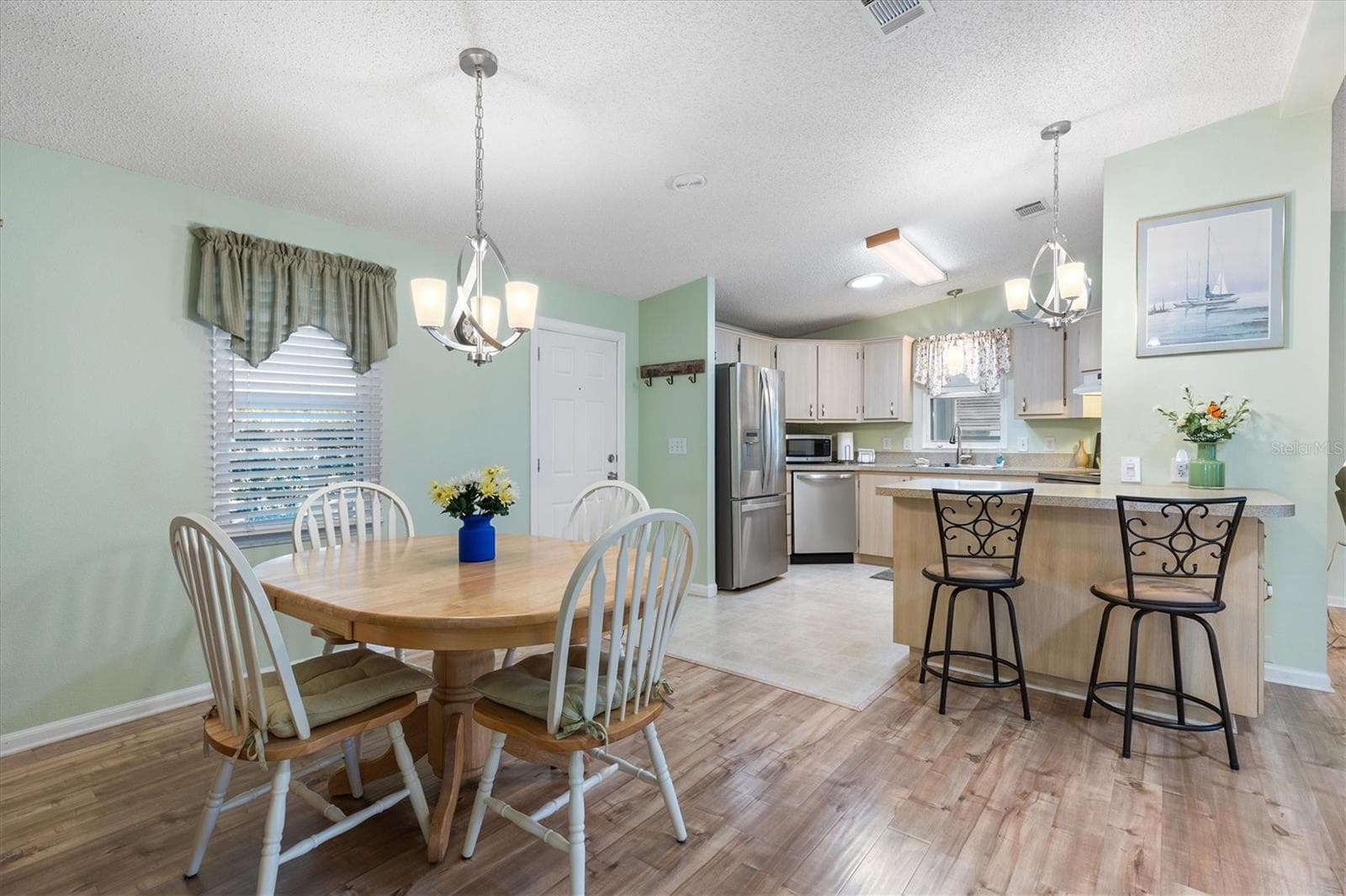 Dining Room and Kitchen - 1228 PALMETTO DR, LADY LAKE