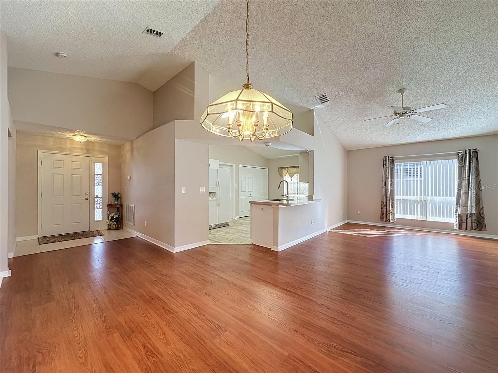 Foyer, Kitchen, Living & Dining Room - 4004 CAPLAND AVE, CLERMONT