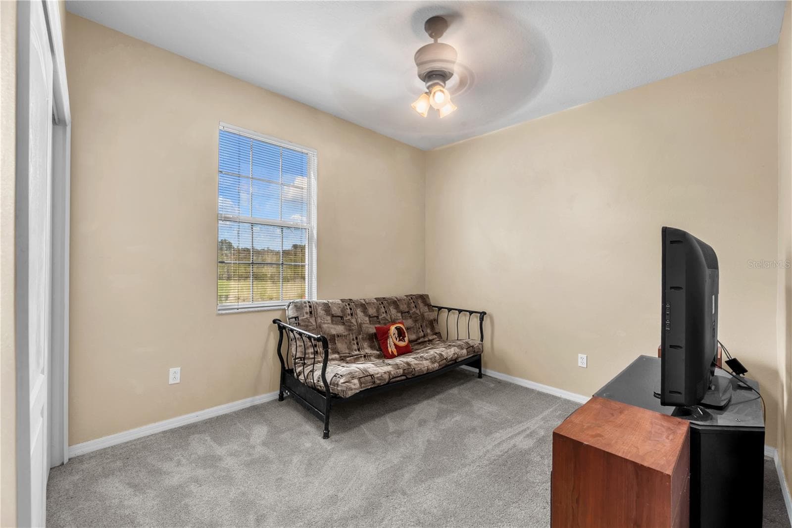 A downstairs bedroom and full bathroom provide wonderful flexibility for overnight guests, multigenerational living, or a private home office. - 18801 SUNTERRA DR, LAND O LAKES