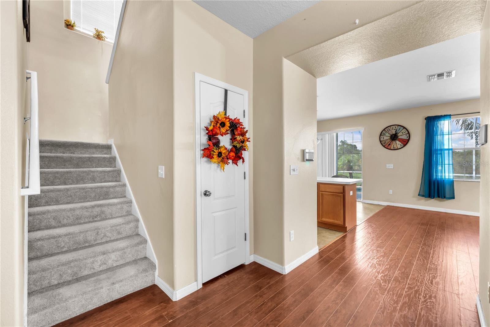 Understair storage leading upstairs to the large primary suite, bonus room, two additional bedrooms sharing a full bath and an oversized laundry room. - 18801 SUNTERRA DR, LAND O LAKES