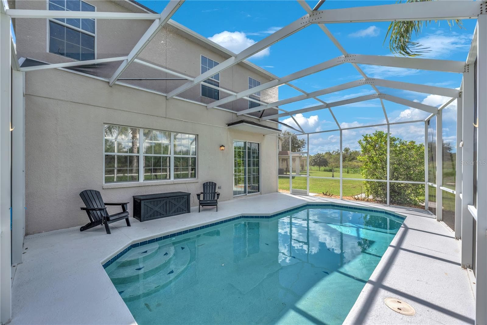 Imagine morning coffee overlooking the water, afternoons spent poolside, and evenings enjoying the beautiful Florida weather. - 18801 SUNTERRA DR, LAND O LAKES