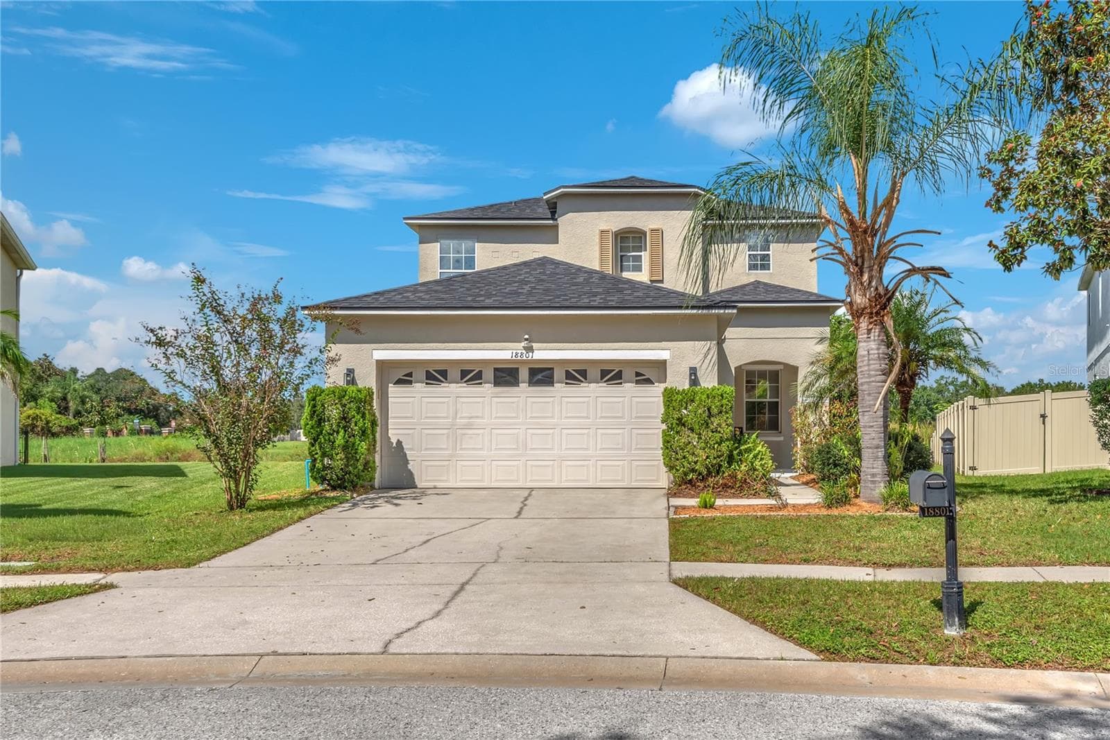 This home has been thoughtfully maintained and updated, including a roof replaced in 2022, dishwasher replaced in 2022, updated washer and dryer in 2021, upgraded A/C system and carpet in 2021, updated primary bathroom flooring and toilet in 2024, security system added in 2024, and refreshed landscaping and enhanced curb appeal in 2026. - 18801 SUNTERRA DR, LAND O LAKES