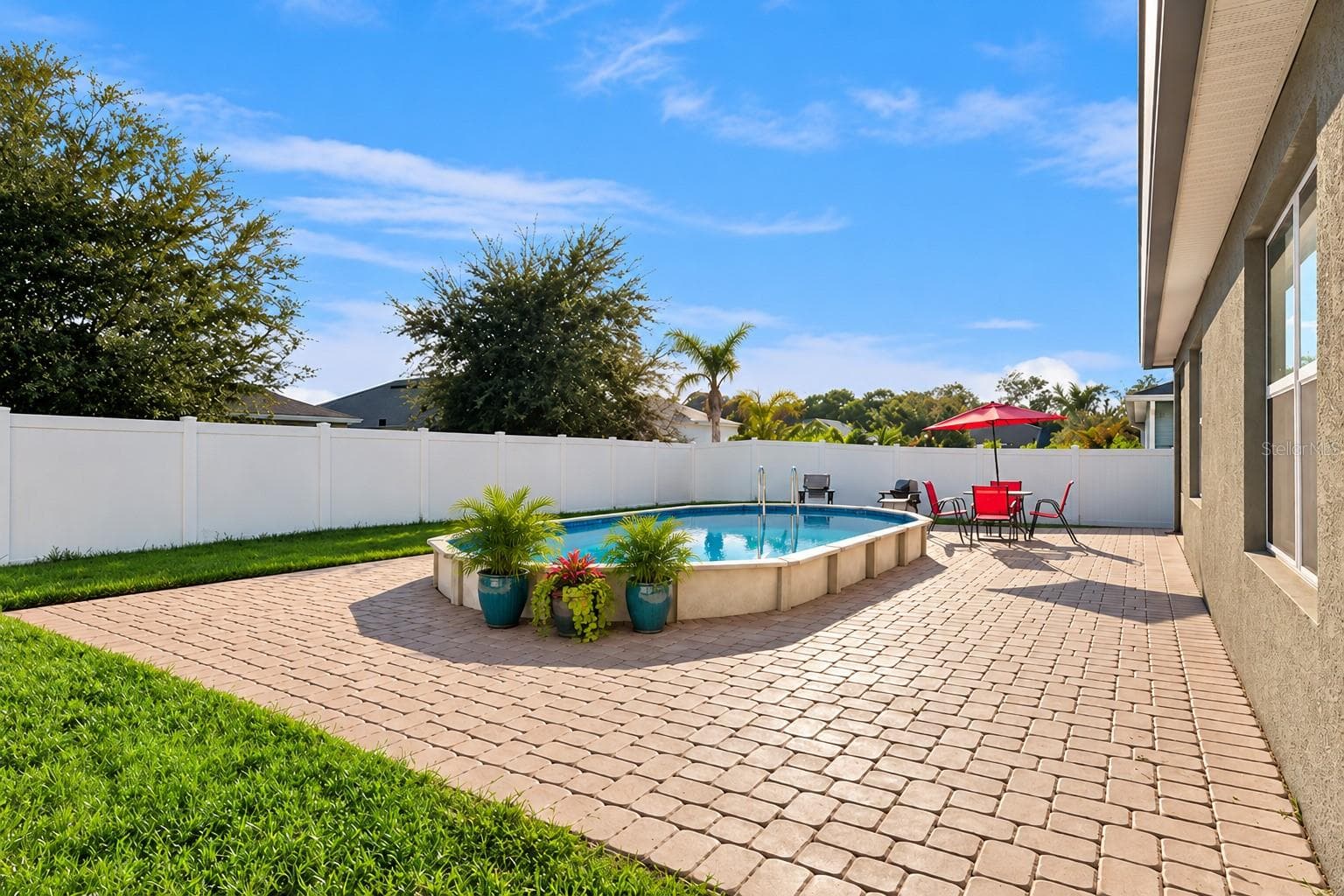 Virtually Added Potted Plants to Pool Deck - 3139 BETHPAGE LOOP, MOUNT DORA