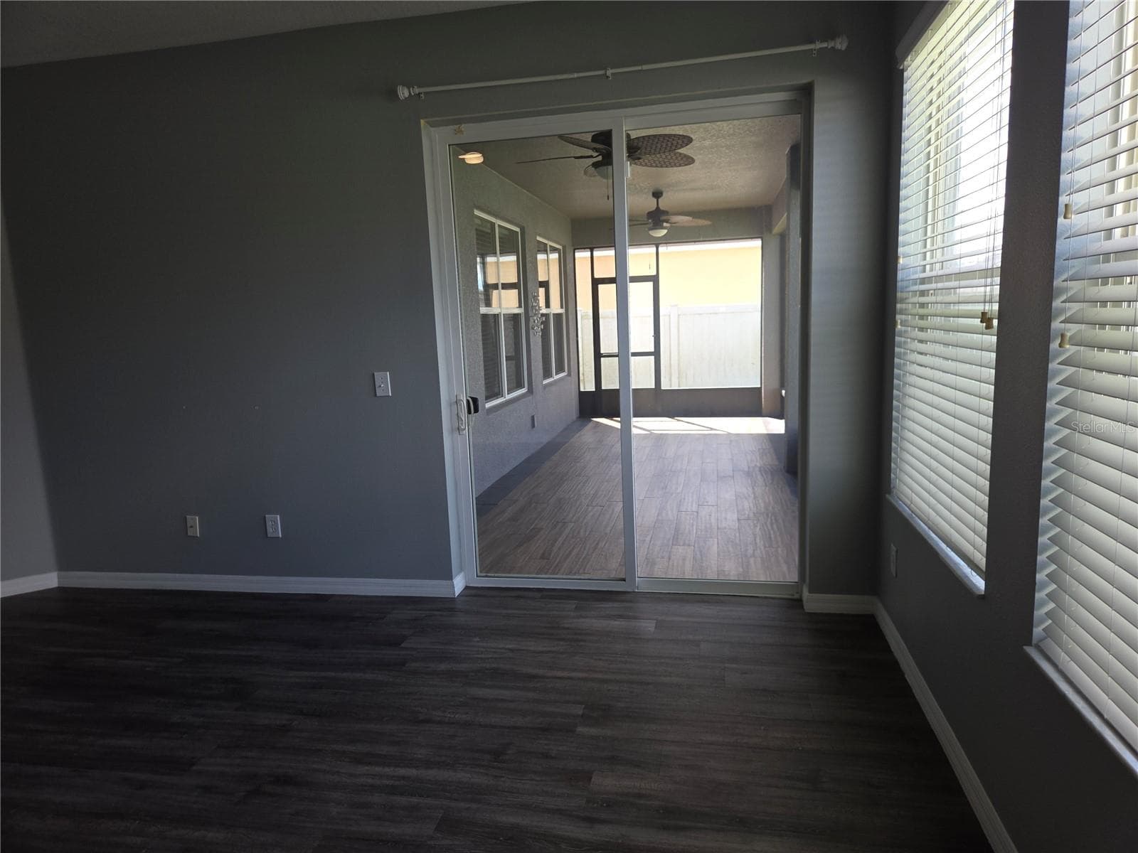 Primary bedroom sliding glass doors to rear lanai - 4620 CYPRESS LANDING LN, ST CLOUD