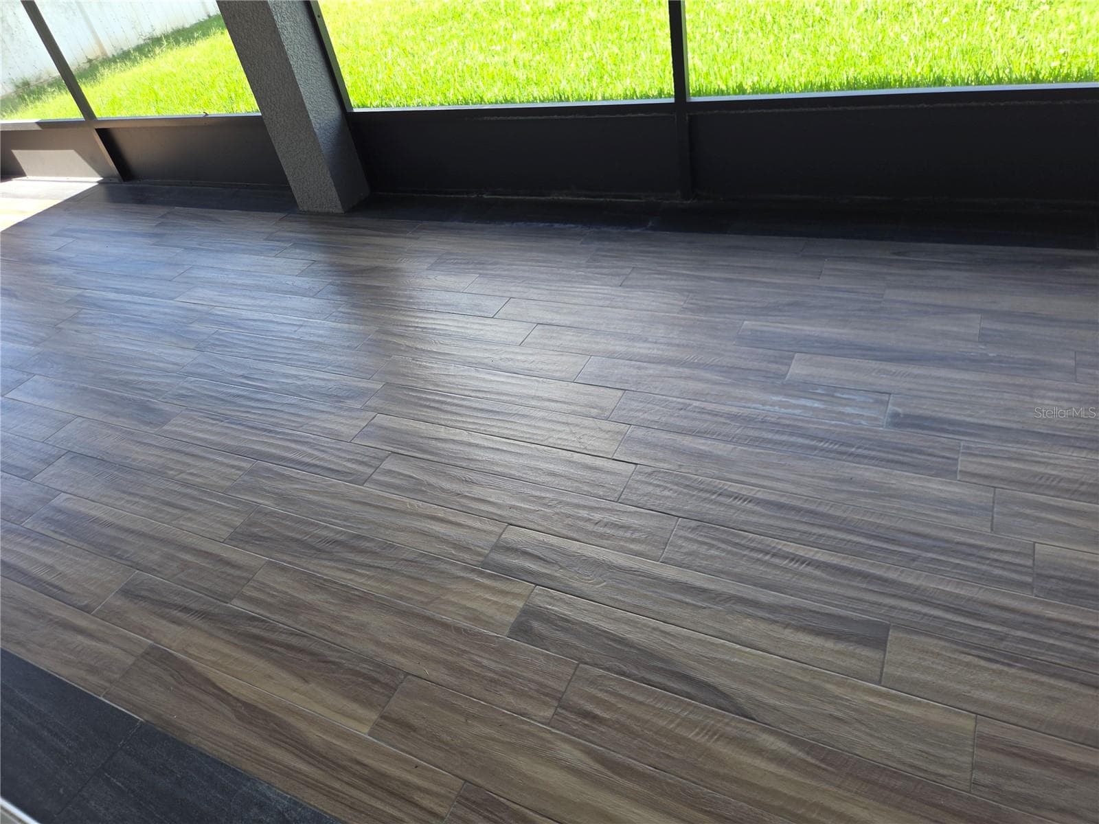 Lanai tile floor - 4620 CYPRESS LANDING LN, ST CLOUD