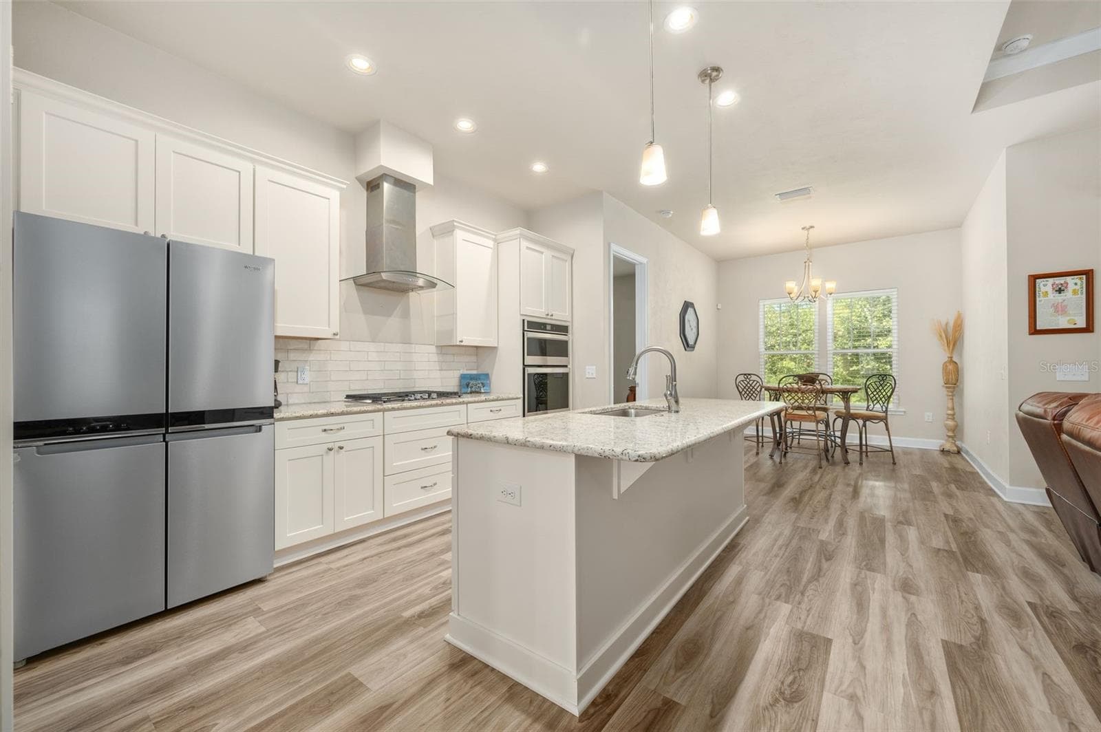 Open Concept Kitchen, Living Room, and Breakfast Nook - 1402 NW 132ND BLVD, NEWBERRY