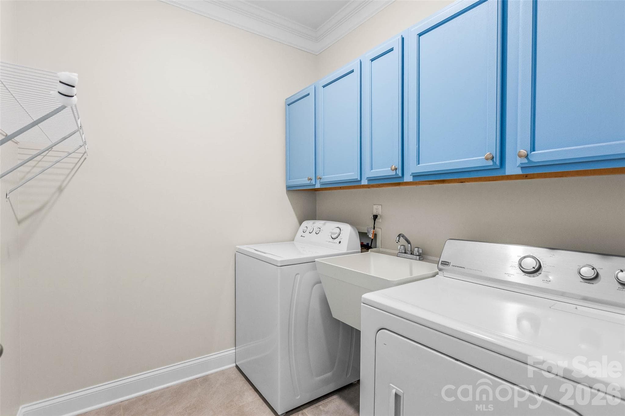 Walk in Laundry room with cabinets & sink! - 4300 Legacy Drive, Denver