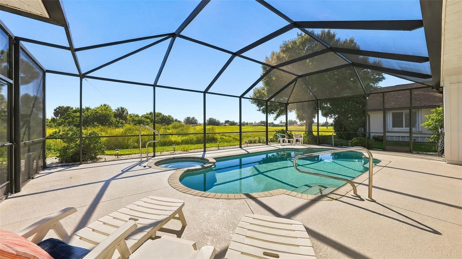 private view of greenspace and then the golf course - 12 MEDALIST CT, ROTONDA WEST