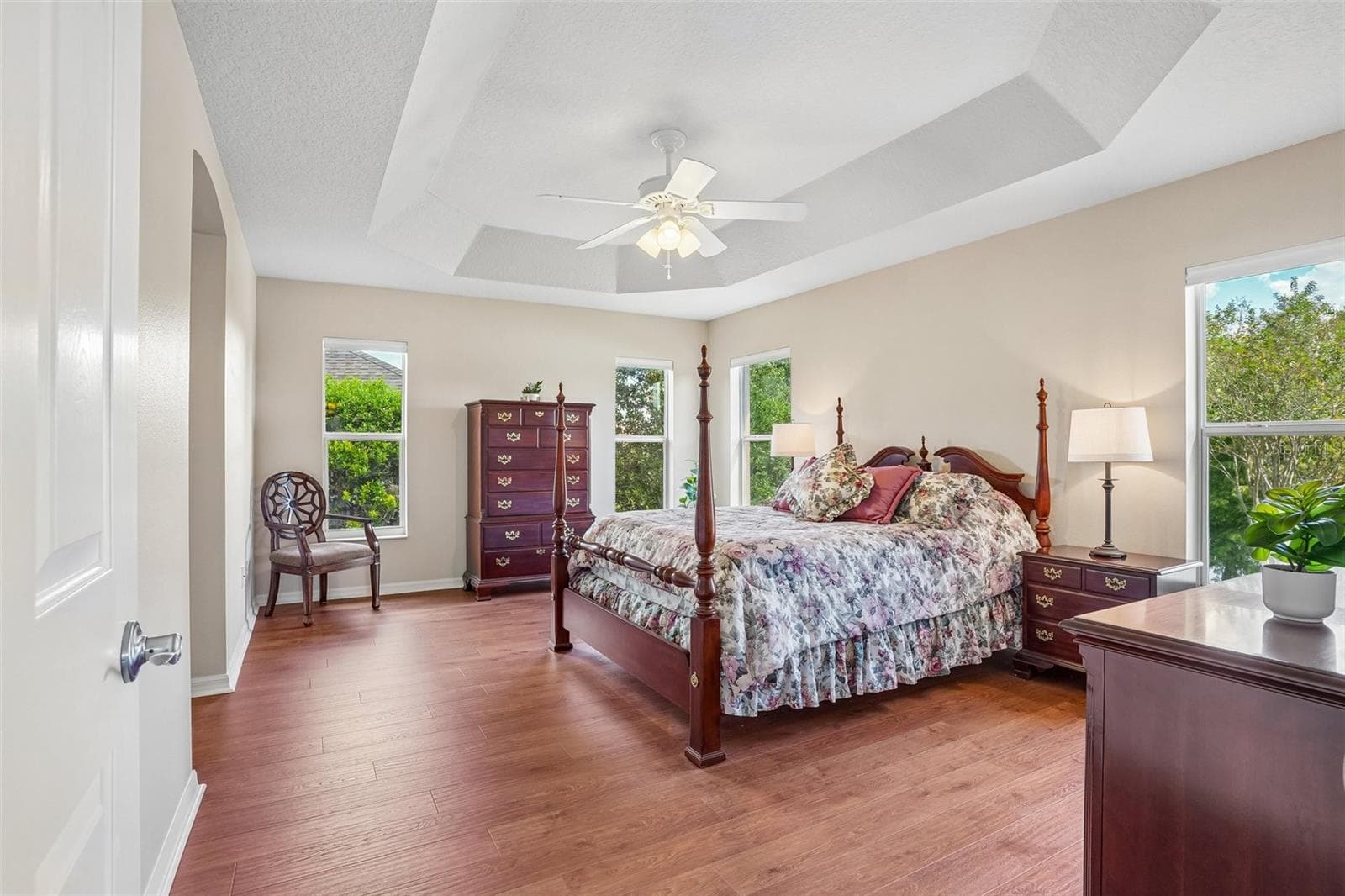 Primary Bedroom with Tray Ceiling & Water View - 494 ARBELLA LOOP, THE VILLAGES