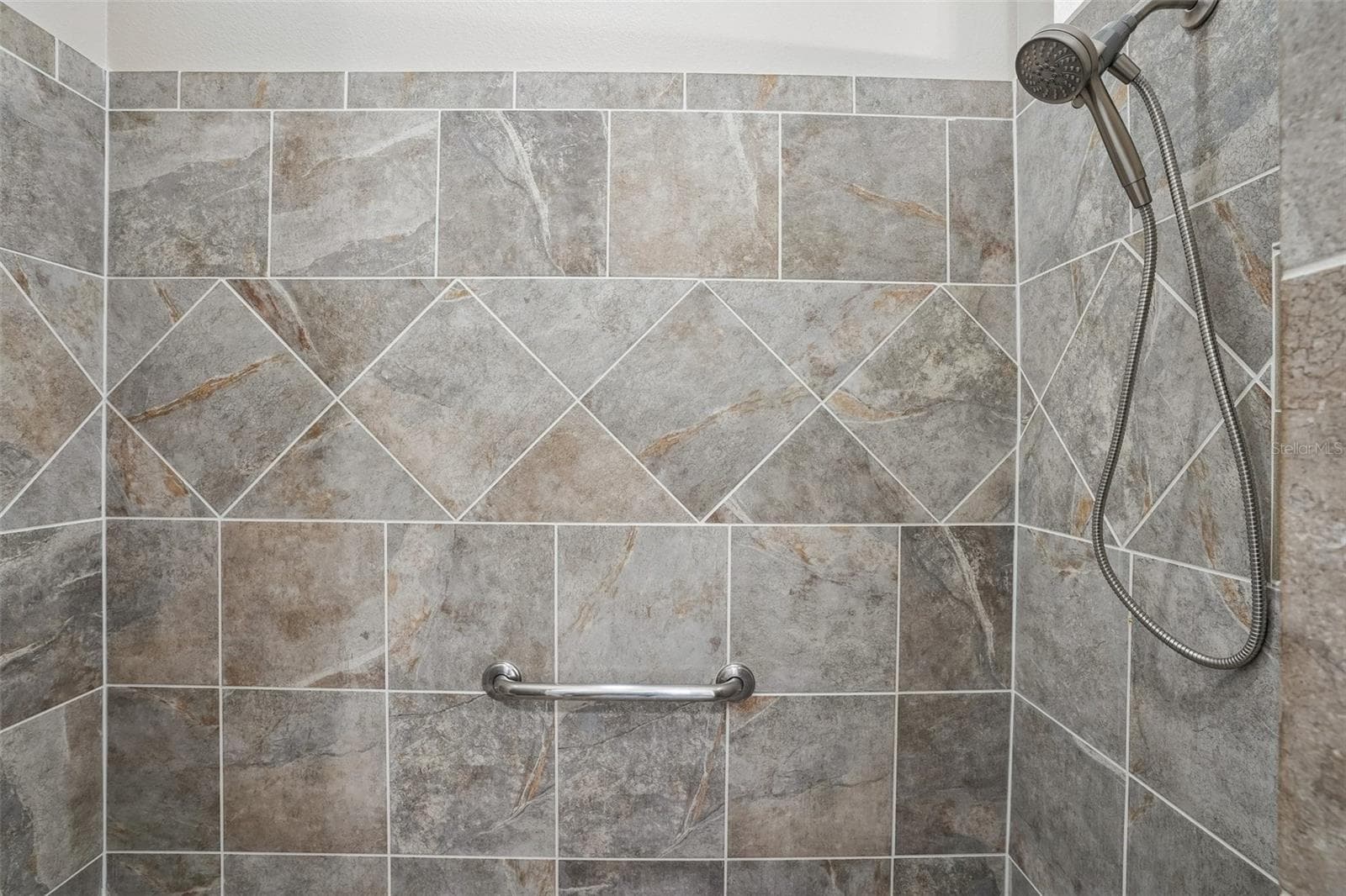 Roman Shower in Primary Bathroom - 494 ARBELLA LOOP, THE VILLAGES