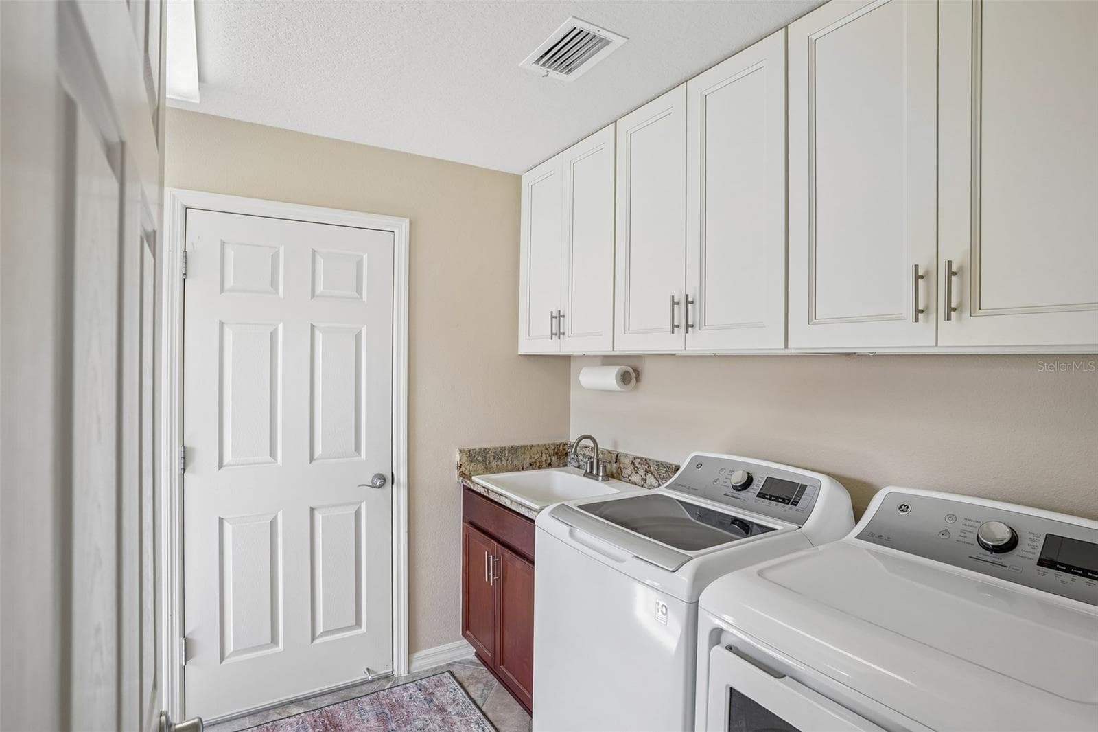 Laundry Room with Sink and New Soft Close Cabinets - 494 ARBELLA LOOP, THE VILLAGES