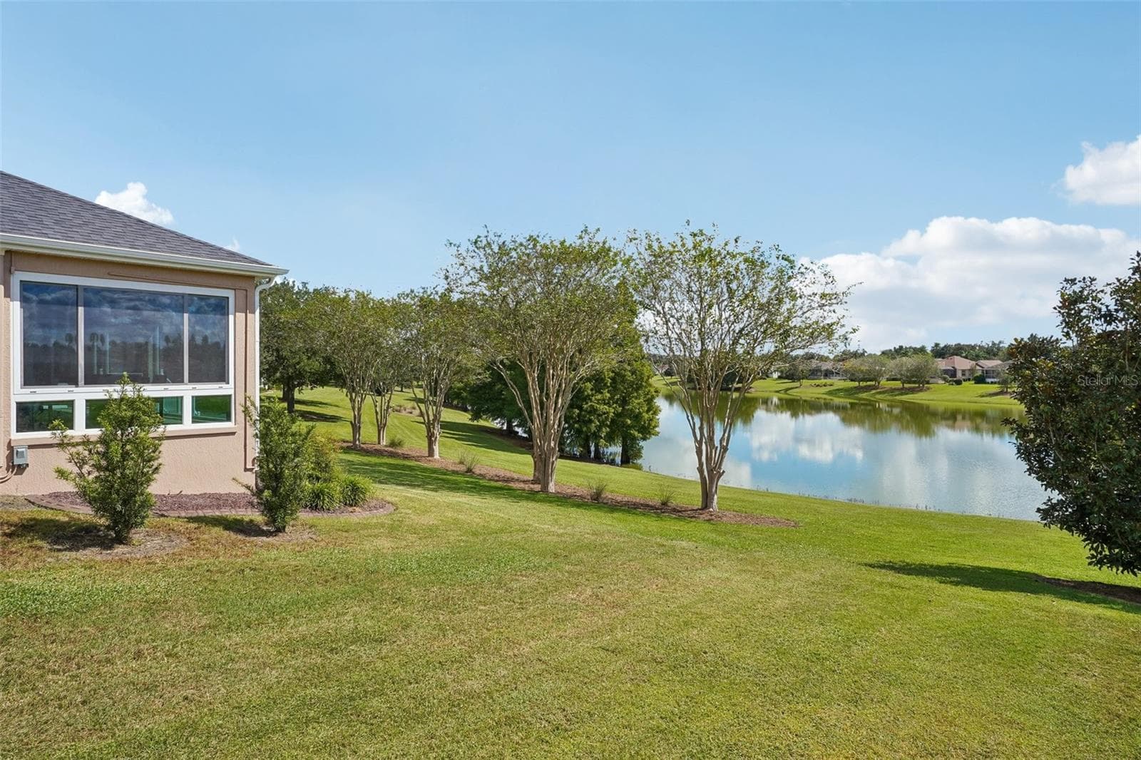 Backyard with Panoramic Water View - 494 ARBELLA LOOP, THE VILLAGES