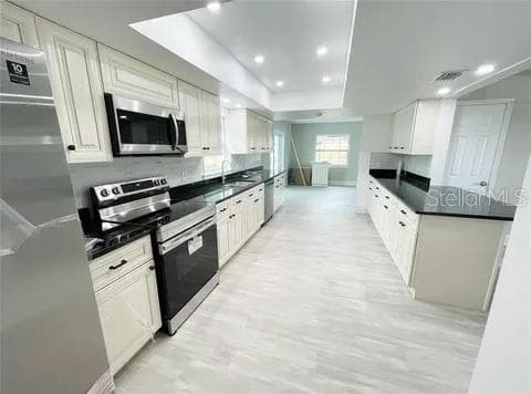kitchen from garage - 2506 PARADISE CIR, KISSIMMEE