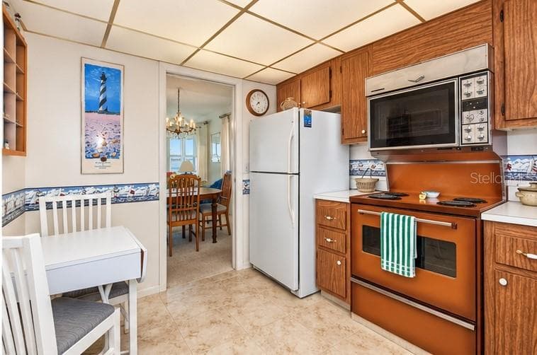 Kitchen with eating space - 4575 COVE CIR #709, ST PETERSBURG