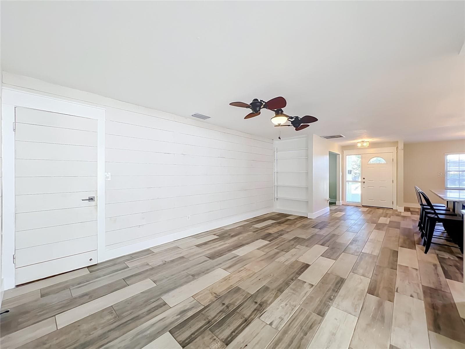 Living Room with Built-In Bookcase - 346 ELKHORN CT, WINTER PARK