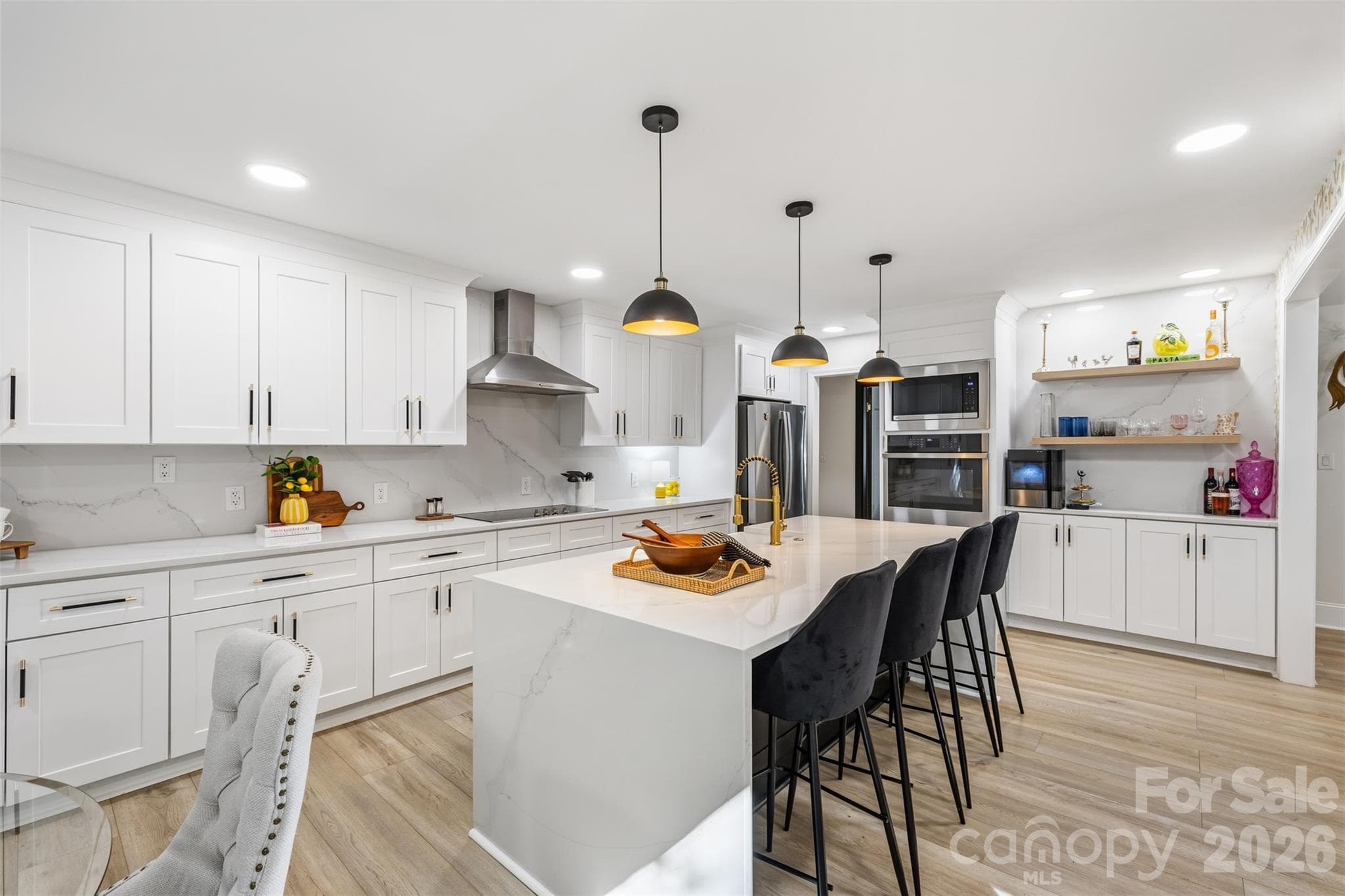 Double ovens, generous storage, and island seating complete the heart of the home - 16 Tanglewood Road, Lake Wylie