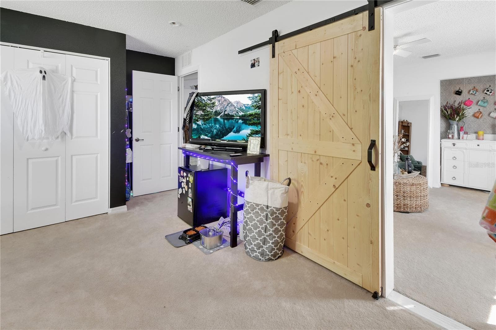 Bedroom 4 has a barn door leading to middle bedroom/family room. - 9 PERTHSHIRE LN, PALM COAST