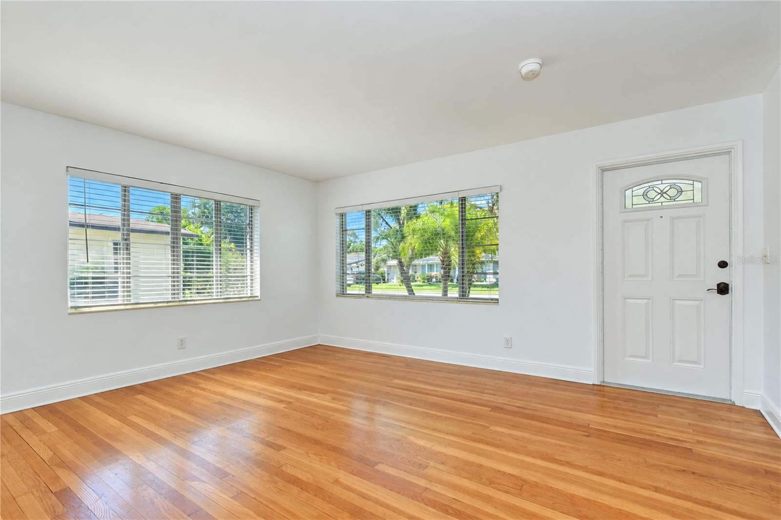 Beautiful wood floors create a warm and welcoming atmosphere throughout the home. - 4508 S LOIS AVE, TAMPA