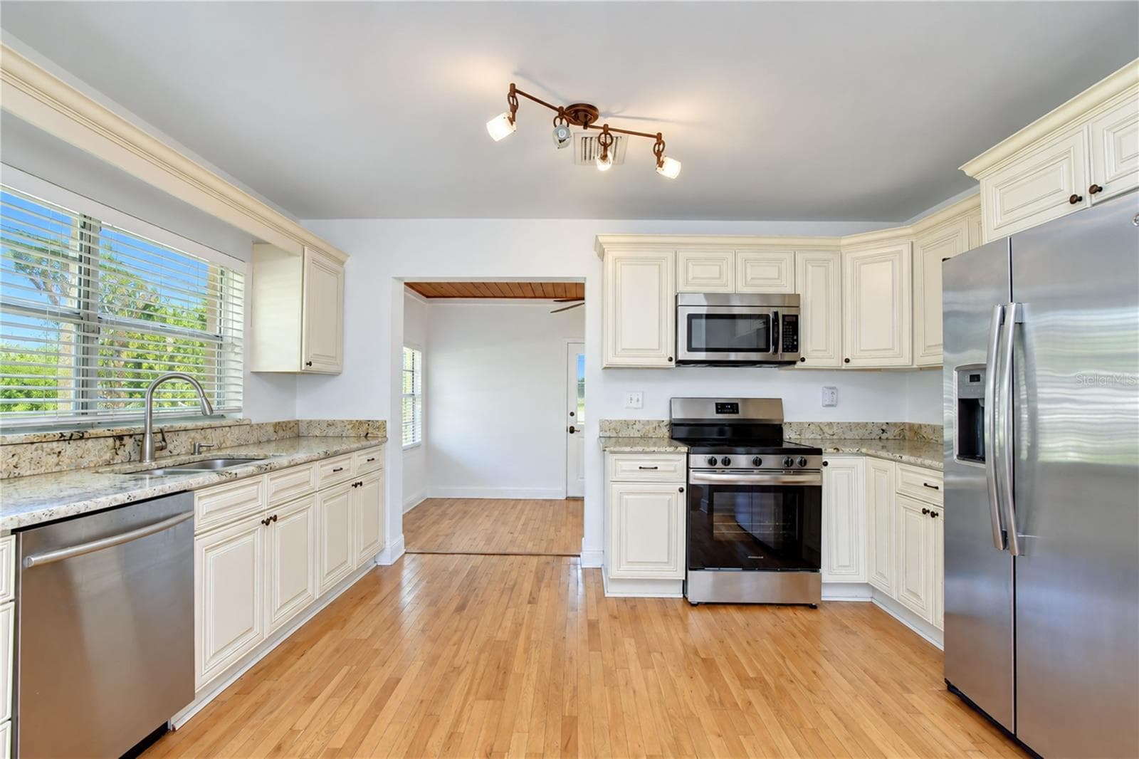 Stylish cabinetry and stainless steel appliances bring a fresh, modern look. - 4508 S LOIS AVE, TAMPA