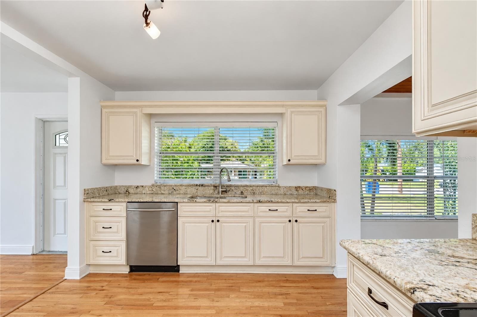 Attractive cabinetry offers practical storage and complements the updated kitchen. - 4508 S LOIS AVE, TAMPA